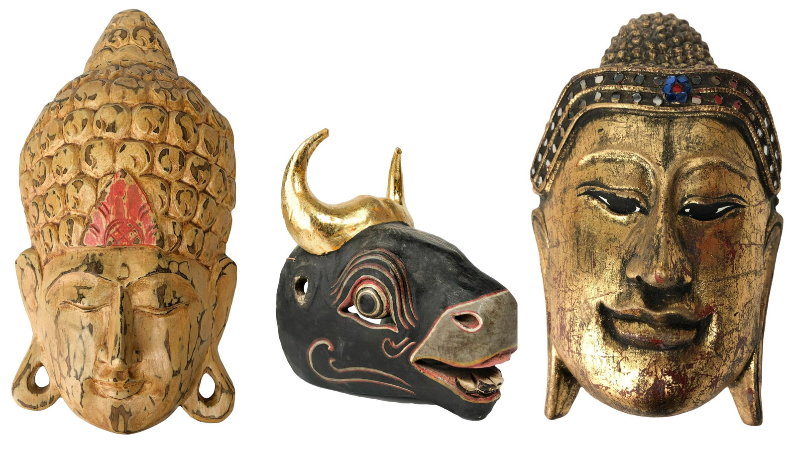 3 Indonesian Bali Hand Carved Figural Wood Masks: Asian hand carved wood. Features (2) wall hanging Buddha faces Largest Buddha measures 14" x 7" x 4"; smaller Buddha head measures 8" x 5" x 4". (1) Bull Mask measuring 7.5" x 8" Condition: Good overa