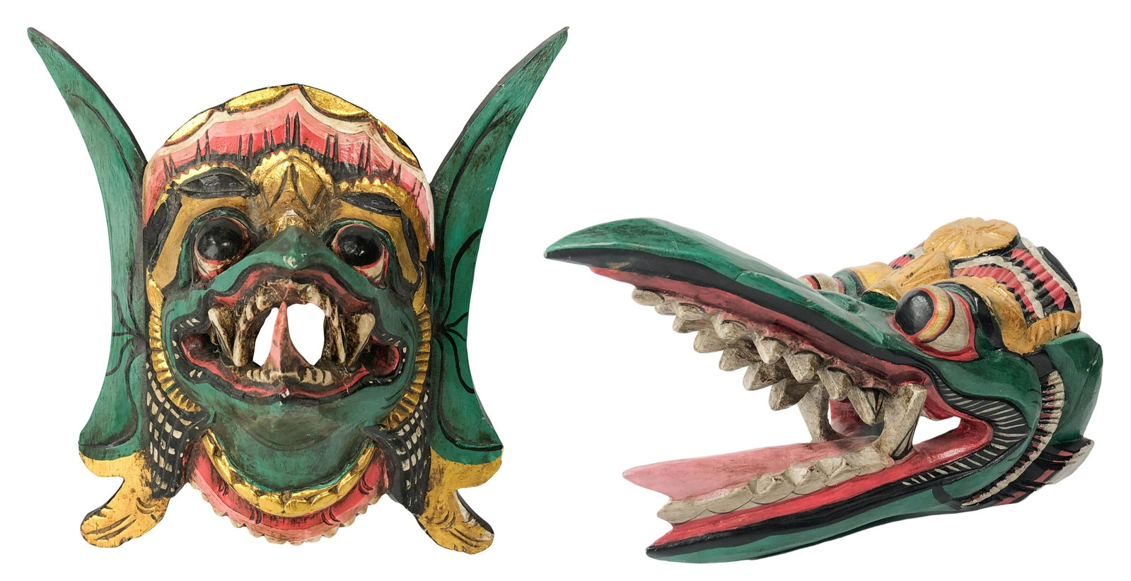 Indonesian Hand Carved Wood Tribal Face Mask LOT: Lot of two hand carved wooden Bali tribal face masks. Green, black, gold and red color palette. Largest measures 8" x 14" x 8"; smallest measures 12" x 10" x 7". Condition: Good overall condition with