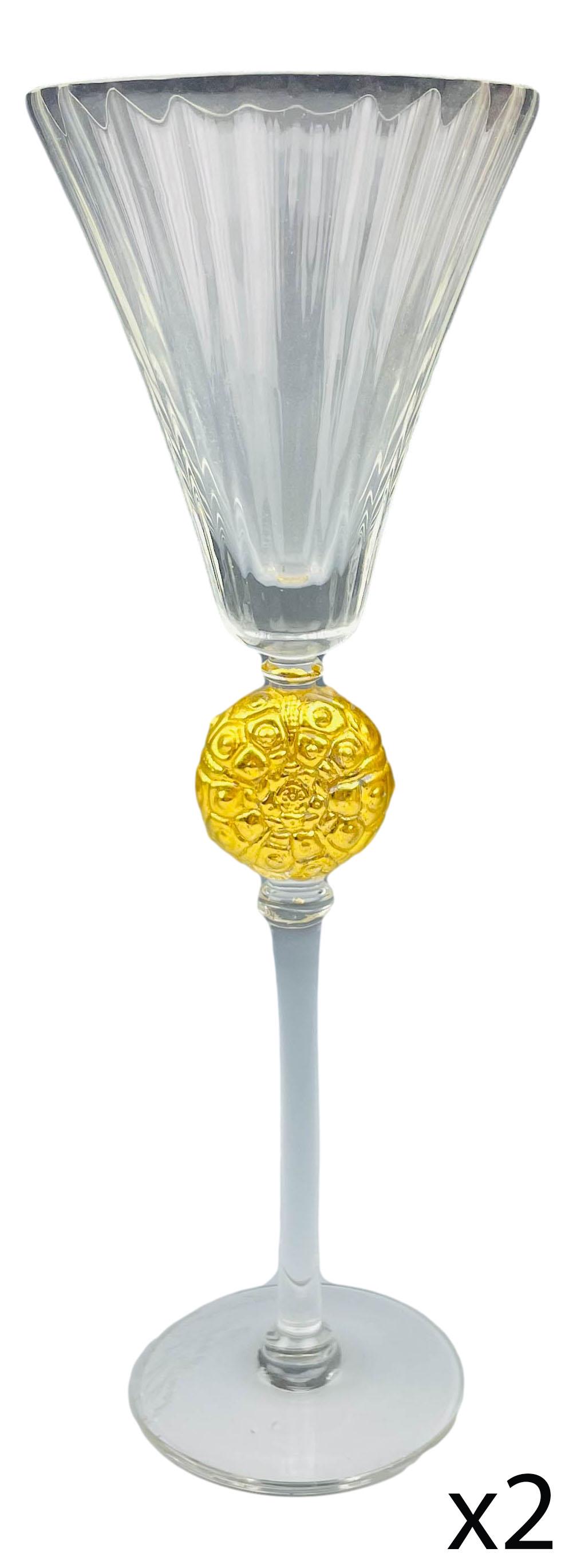 Murano Art Glass Gold Gilt Wine Goblets x 2 SIGNED: 20th century studio hand blown art glass bar barware goblets. The tapered bowls with a vertical ribbed pattern over a textured gold painted ball over slender stems over spreading circular bases. Measu