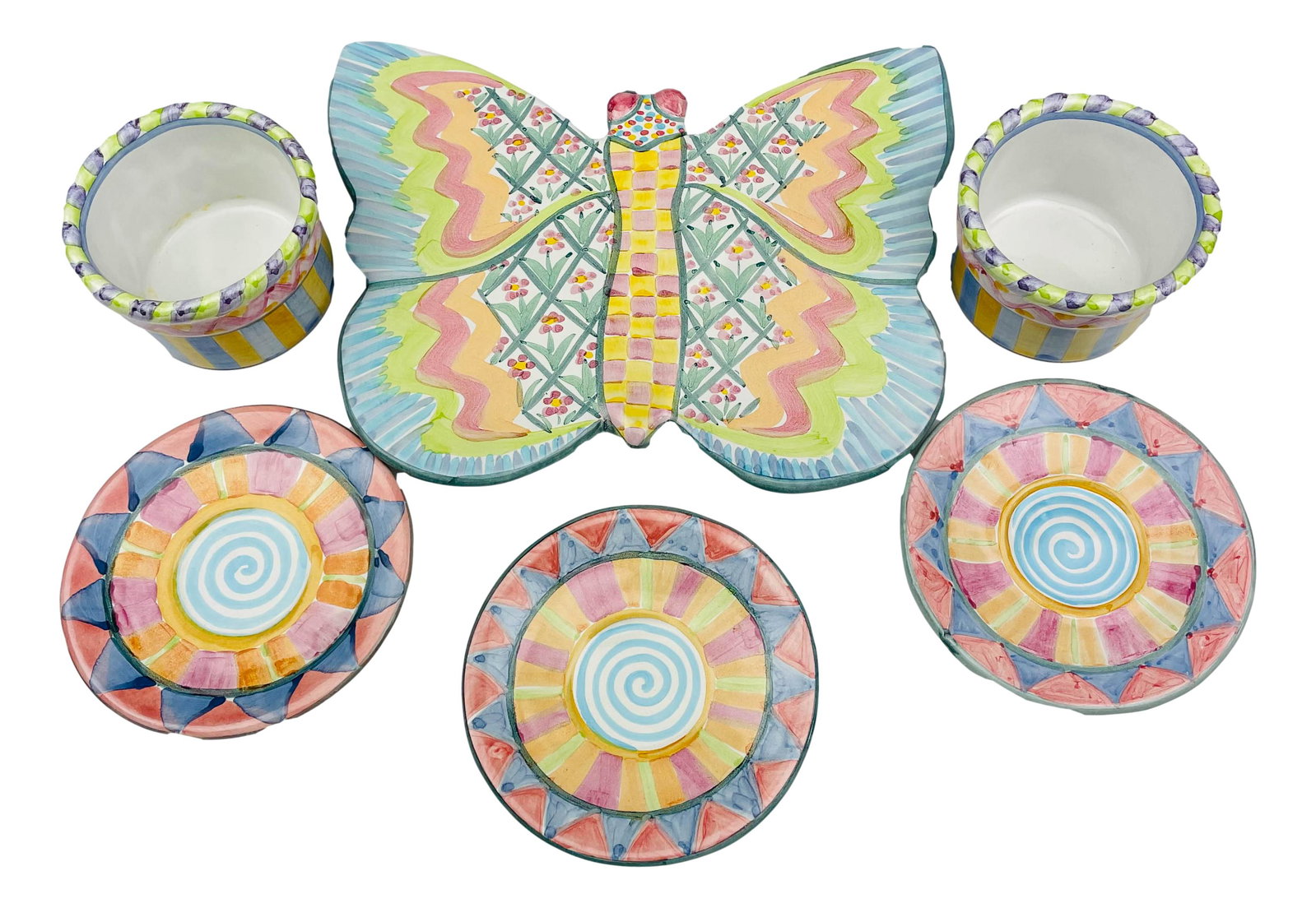 MacKenzie Childs Butterfly Trivet Bowls & Saucers: MacKenzie Childs Ltd is a manufacturer of ceramics and retailer of hand painted imported furniture and home decor based in Aurora, New York. Founded by Victoria and Richard MacKenzie Childs ~ 1983. In
