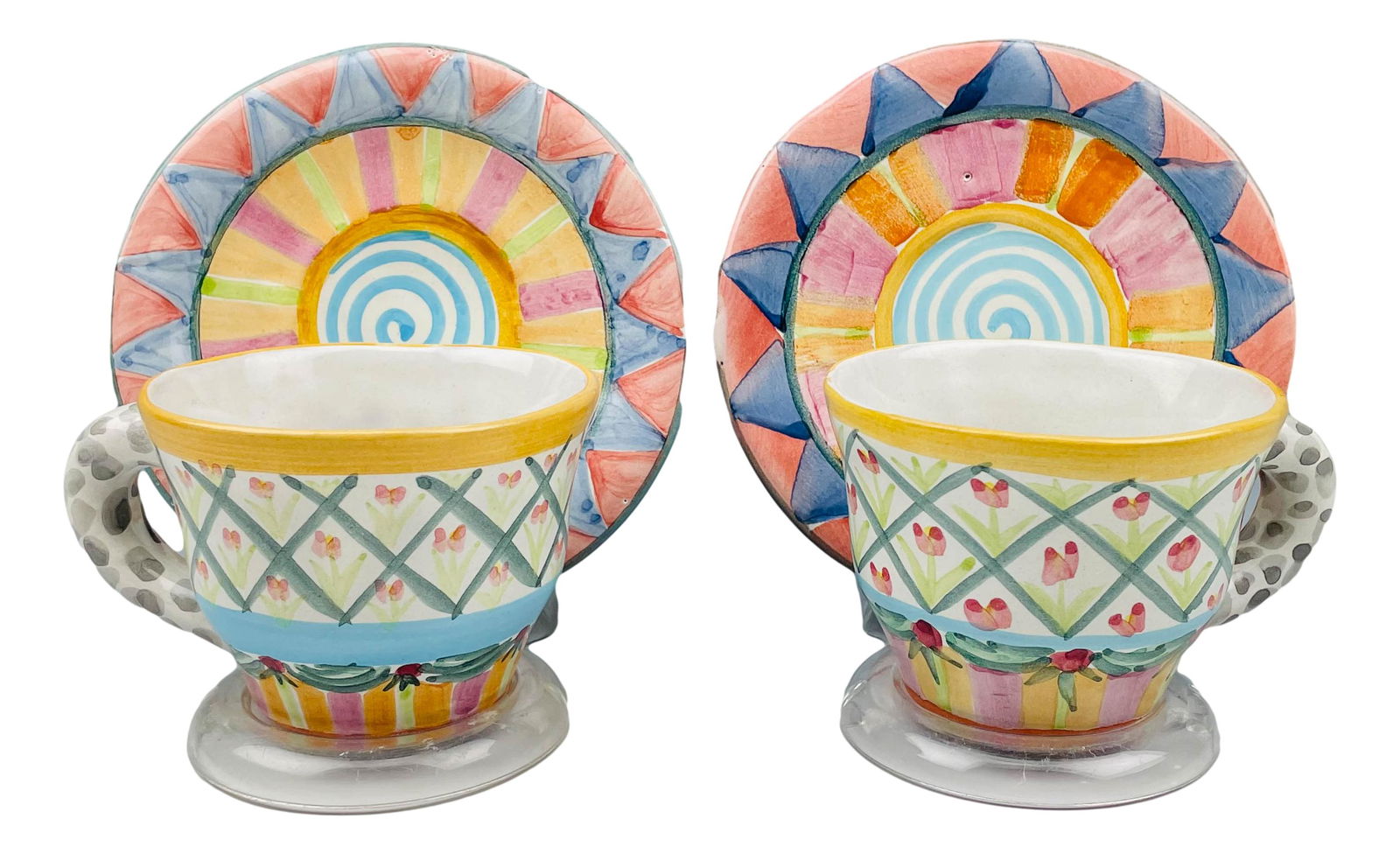 MacKenzie Childs Tulip Ceramic Tea Cup Saucers x 2: MacKenzie Childs Ltd is a manufacturer of ceramics and retailer of hand painted imported furniture and home decor based in Aurora, New York. Founded by Victoria and Richard MacKenzie Childs ~ 1983. Pa
