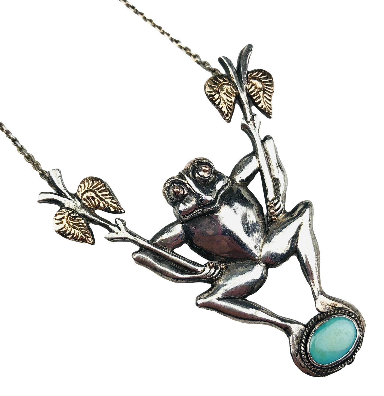 Mystery Artist Whimsical Frog Turquoise Necklace: Palm Beach Regency style vintage necklace. Depicts a frog holding two palmette branches with gold accented leaves while balancing on a turquoise gemstone. Marked 925. Approximately 16" with a 2 3/4" x