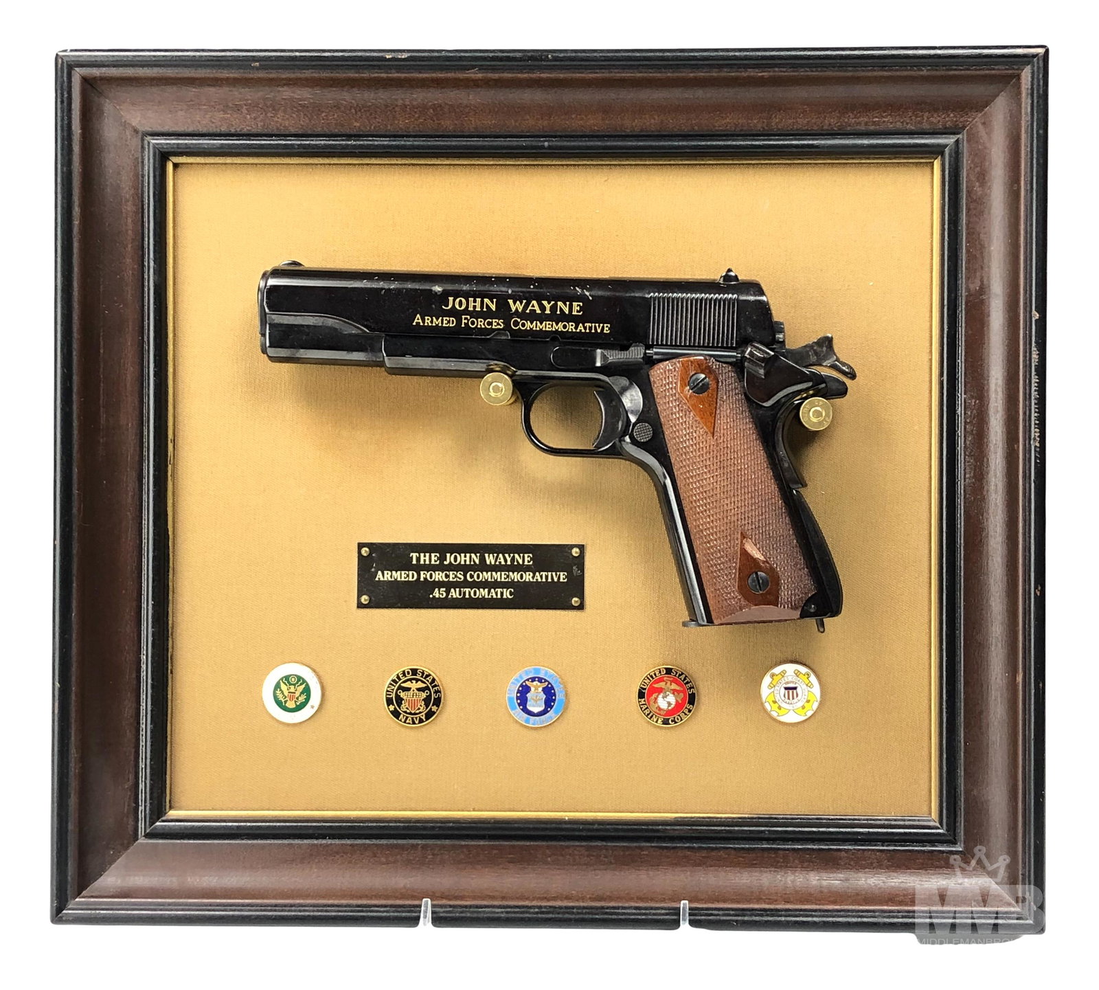 John Wayne Colt .45 Automatic Framed Replica Gun: John Wayne Armed Forces Commemorative .45 replica NON FIRING re-creation of the sidearm carried by Wayne in most of his military films. Engraved with a copy of his signature. This issue commemorates t