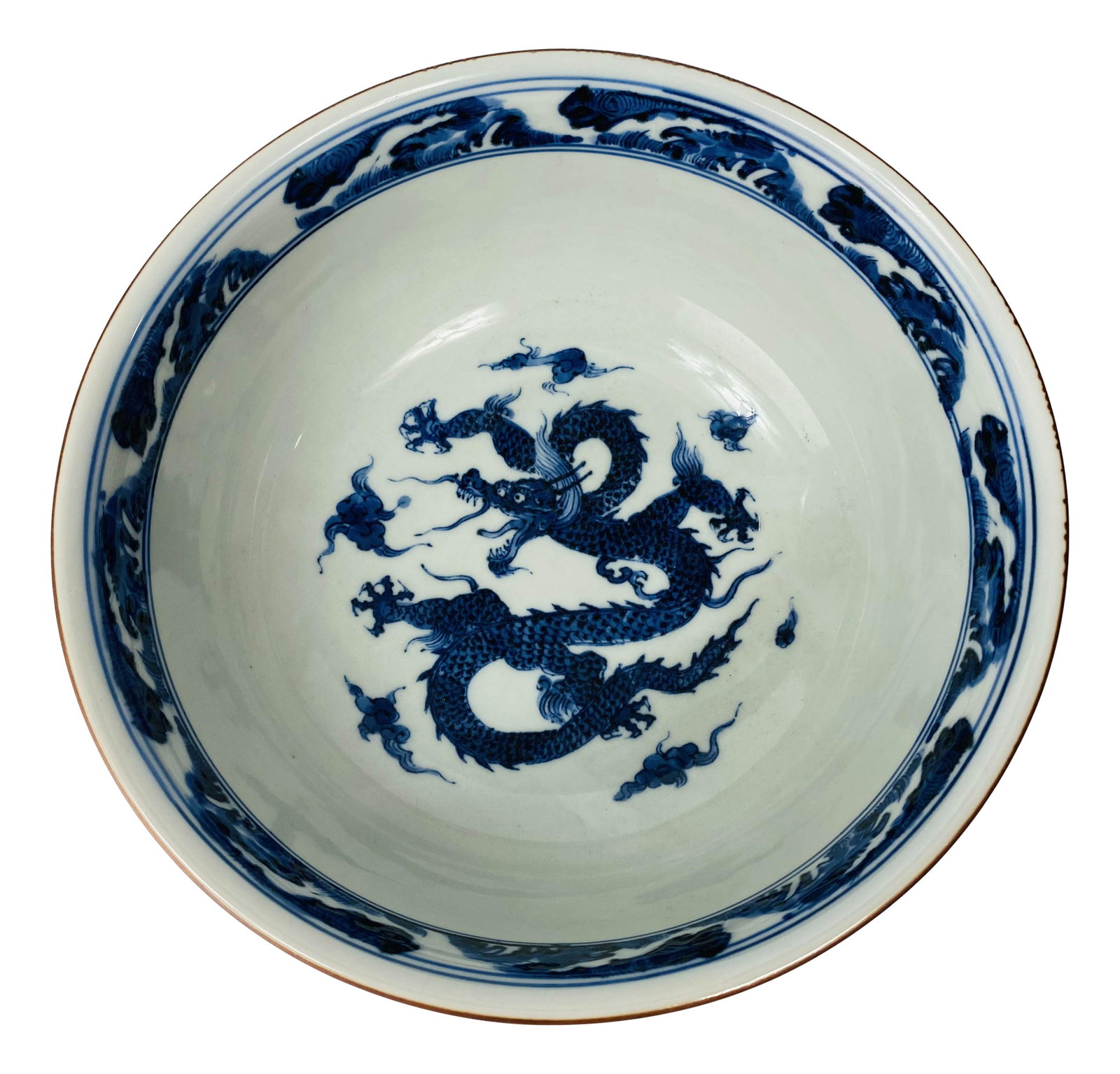 Fitz & Floyd Flying Dragon Chinese Vegetable Bowl: Fitz and Floyd porcelain vegetable bowl. Features a flying five toed dragon in blue on a white ground with a dark red exterior. Marked on bottom. Dimensions: 3.75 X 8.25 X 8.25 in. Condition: Goo