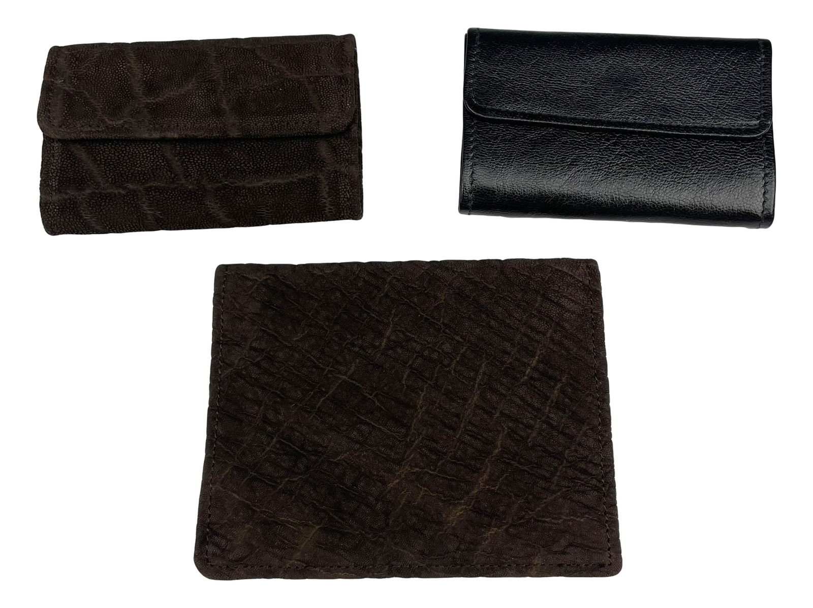 Stanley Noymer England Leather Keychain Wallet x 3: Includes the following articles. 1 x French Kid leather key holder. 1 x elephant hide leather key holder. 1 x elephant hide leather wallet. All three are housed in their presentation boxes. Measure fr