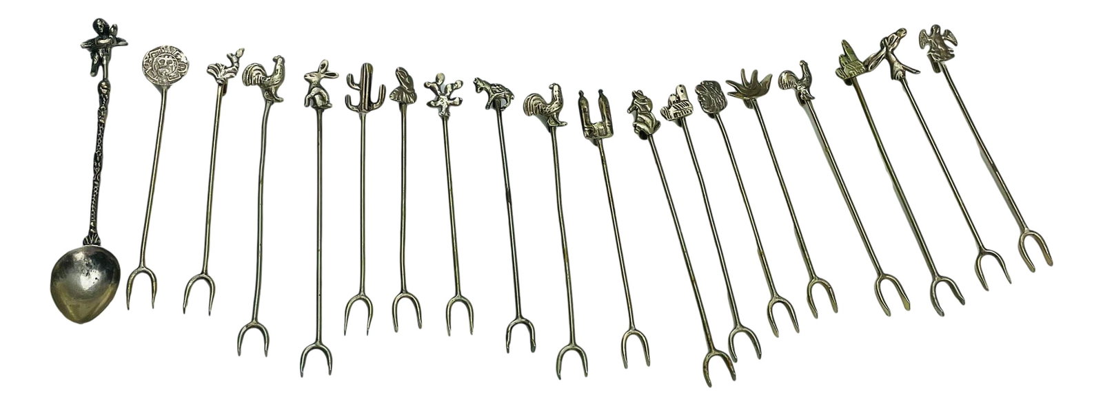 850 Silver Hor D'Oeuvre Picks & Spoon 19pc LOT: Lot includes 18 x 850 silver hor d"oeuvre appetizer picks and a demitasse 800 silver spoon. Each pick with a decorative elements on one side. Spoon with a figural winged cherub at the end. Measure fro