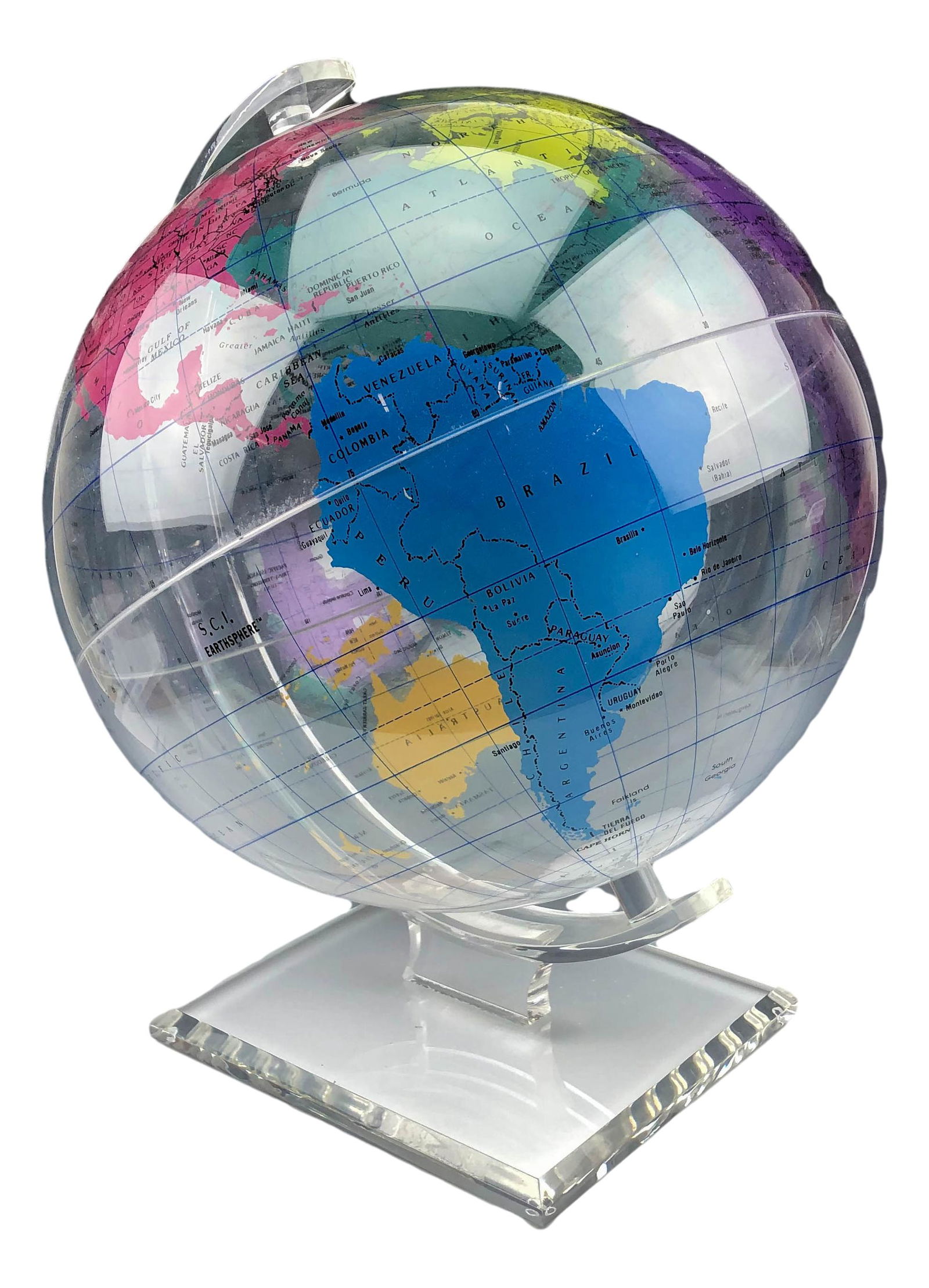 Clear Acrylic Revolving World Globe on Lucite Base: LARGE "Spherical Concepts" clear lucite acrylic globe. Mounted atop a clear solid thick walled curved lucite stand. Measures 12". Signed ~ stamped Spherical Concepts. Condition: Good overall condition