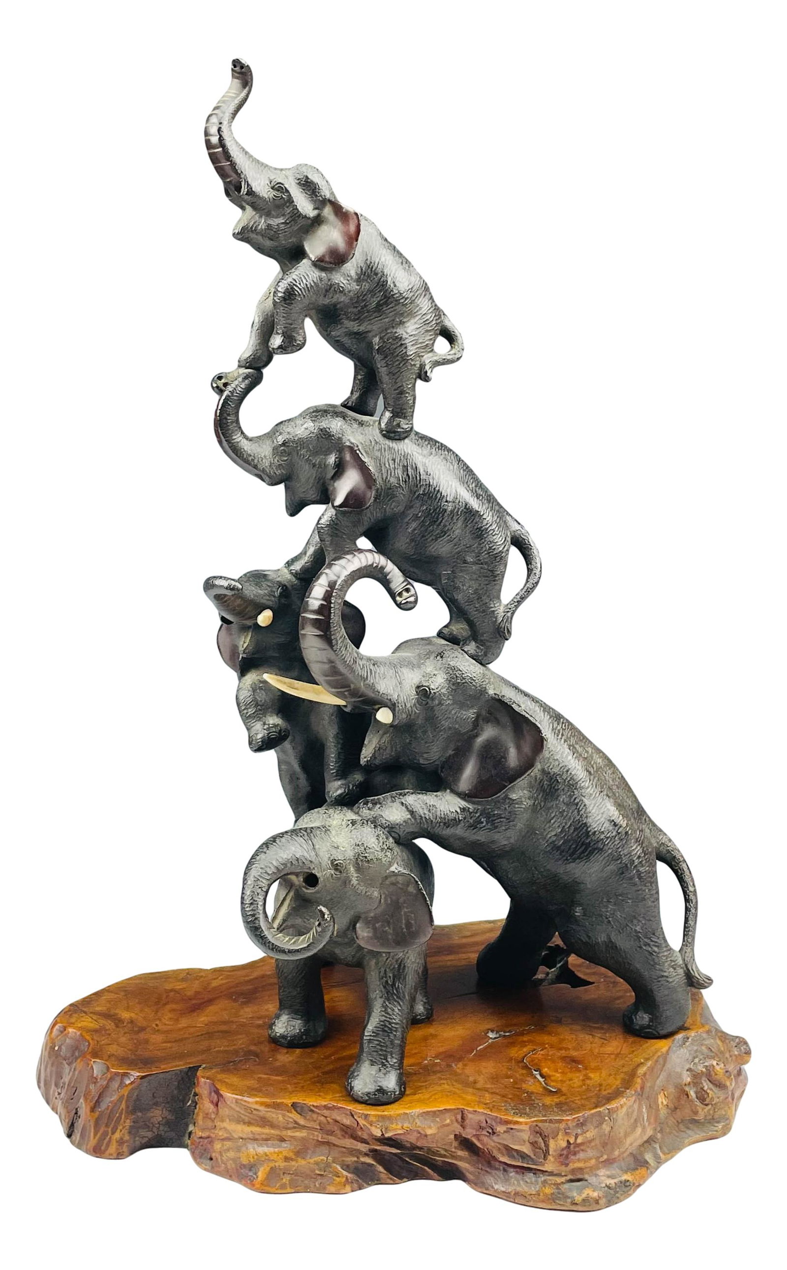 Japanese Elephant Family Bronze Sculpture: Japanese animalier wildlife bronze sculpture featuring totem pole style stacked elephants with trunk up. Designed to rest on a dark colored sliced burl wood base. Measures 14" x 7". The base only meas