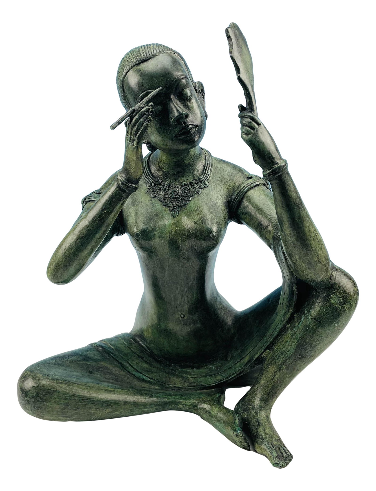 Patinated Bronze Figural Nude Woman Sculpture: Subject matter is that of a seated nude woman, with slicked back hair, having amulets on each hand, holding a hand mirror and a makeup brush. Smooth polished finish with green verdigris patination. Me