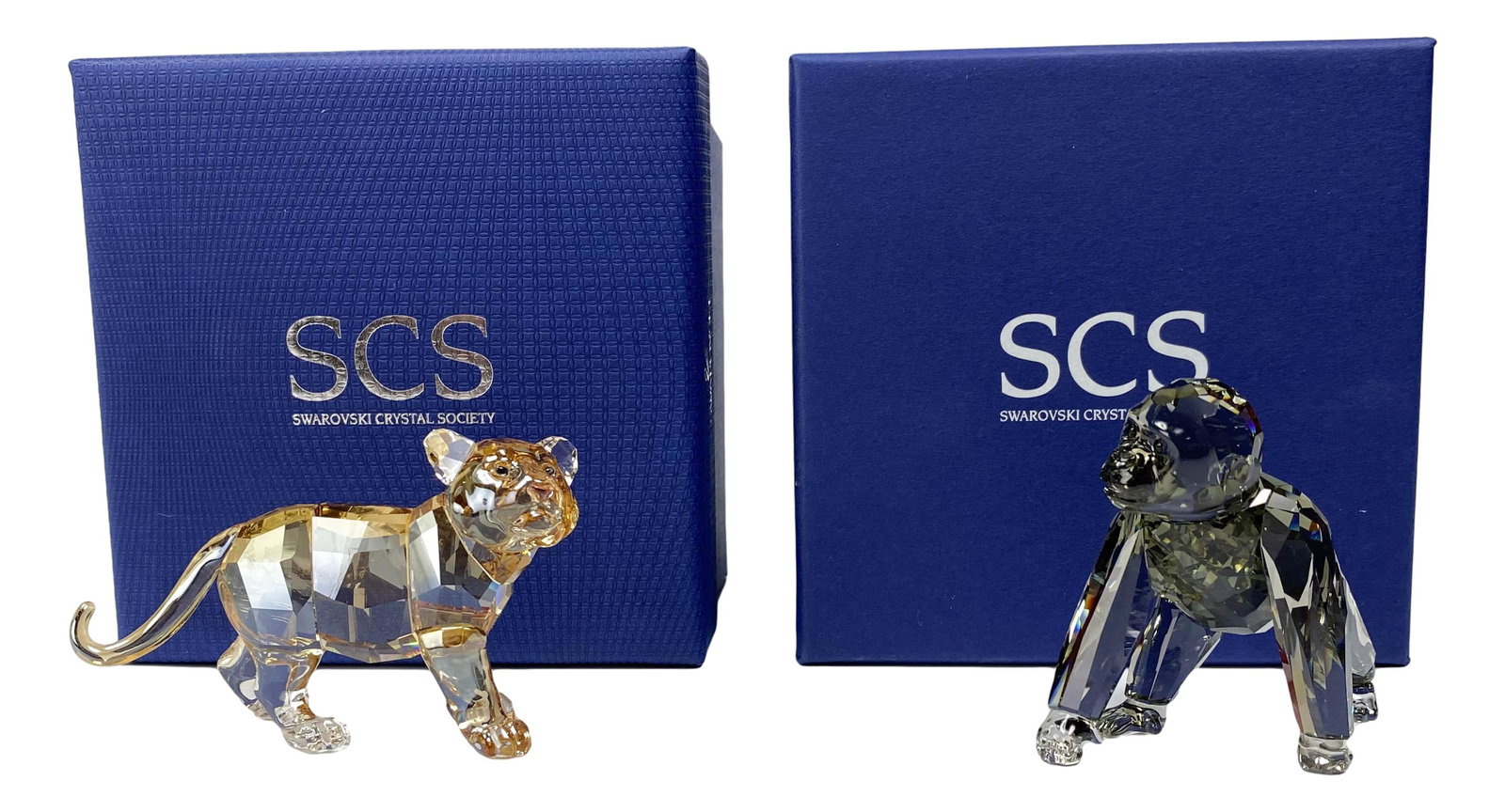 Swarovski Gorilla & Tiger Cub Figurines Box & COA: Gorilla cub designed by Anton Hirzinger: Production years : 2009 - 2009. The Tiger cub standing designed by Elisabeth Adamer, Production years : 2010 - 2010. Each housed in its original presentation b