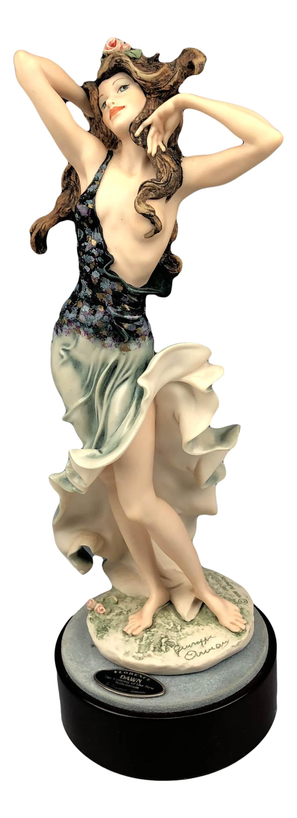 Armani Dawn #1409C Limited Edition Lady Figurine: Giuseppe Armani ( Italian, 1935 - 2006 ). Celebrated and internationally respected artist / designer and sculptor. Titled Dawn #1409C. Dawn depicts the embodiment of the new millennium. Executed in a 