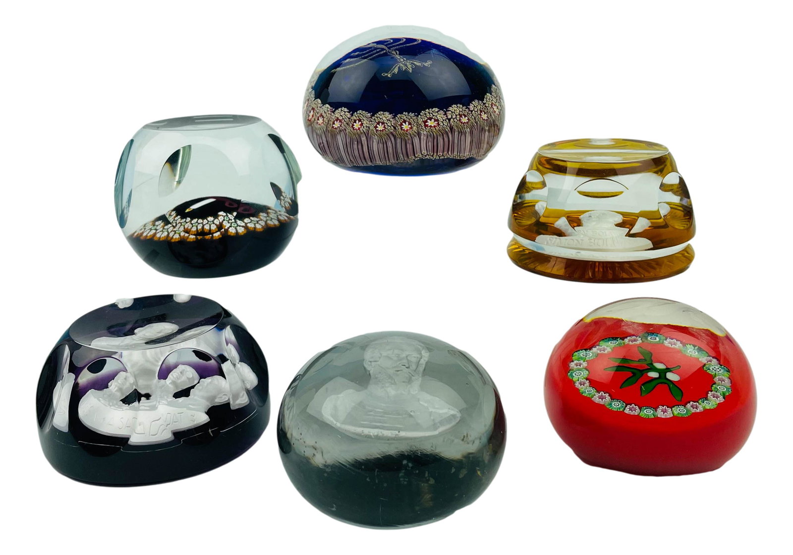 Paperweight Art Glass Estate Collection 6 pc LOT: Includes ~ 1 x signed Colin Terris for Caithness # 44 /500 along with paper sticker. 1 x menorah. 1 x Perthshire Scotland with paper sticker. 1 x Baccarat sulfide paperweights with bust of Simon Boliv
