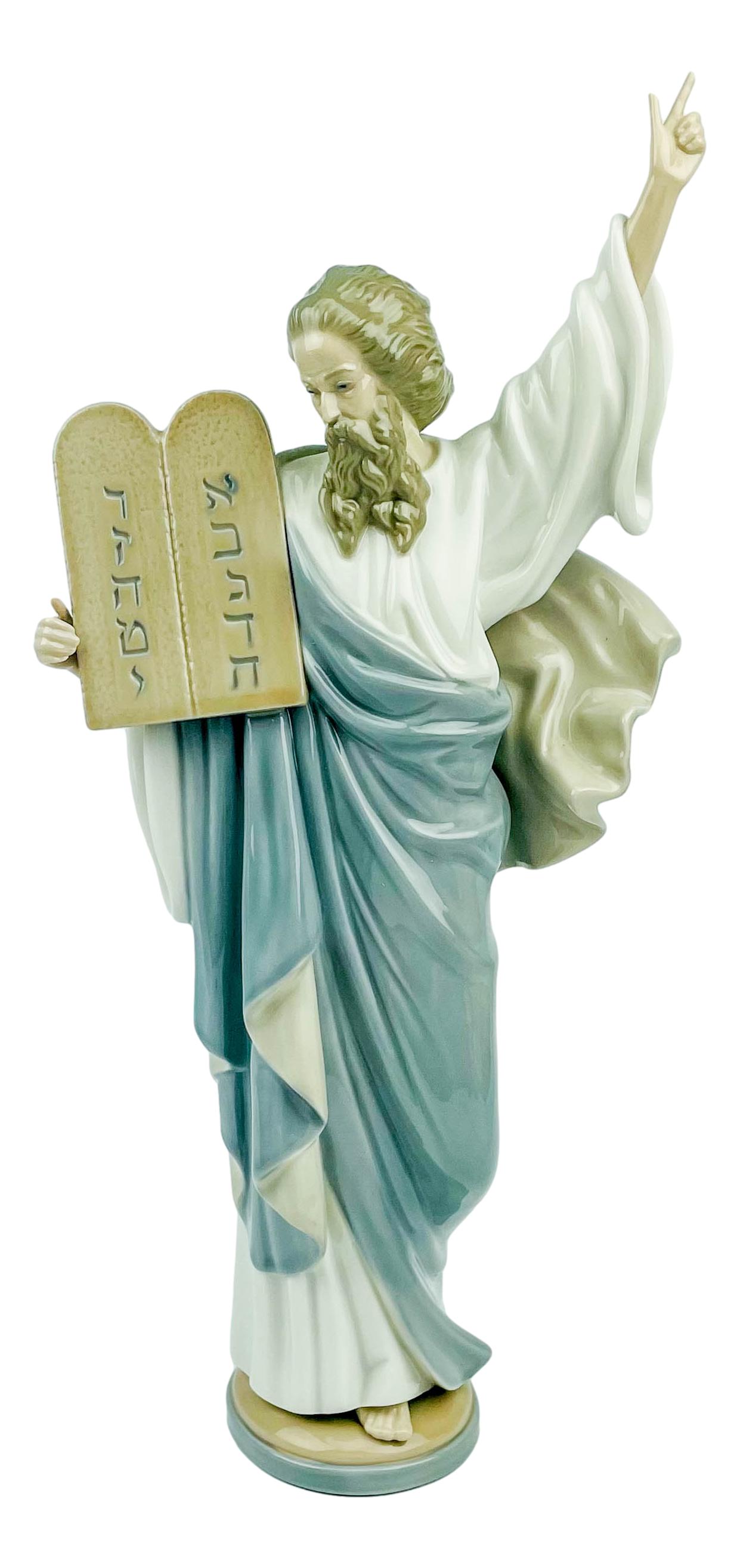 Lladro Moses # 5170 Religious Porcelain Figurine: Designed by sculptor Francisco Catala. Production years : 1982 - 2000. Finish : Glazed. Signed ~ stamped with the blue tulip Lladro Handmade in Spain Daisa 1982. Dimensions: 16 X 7.5 X 3 in. Condition