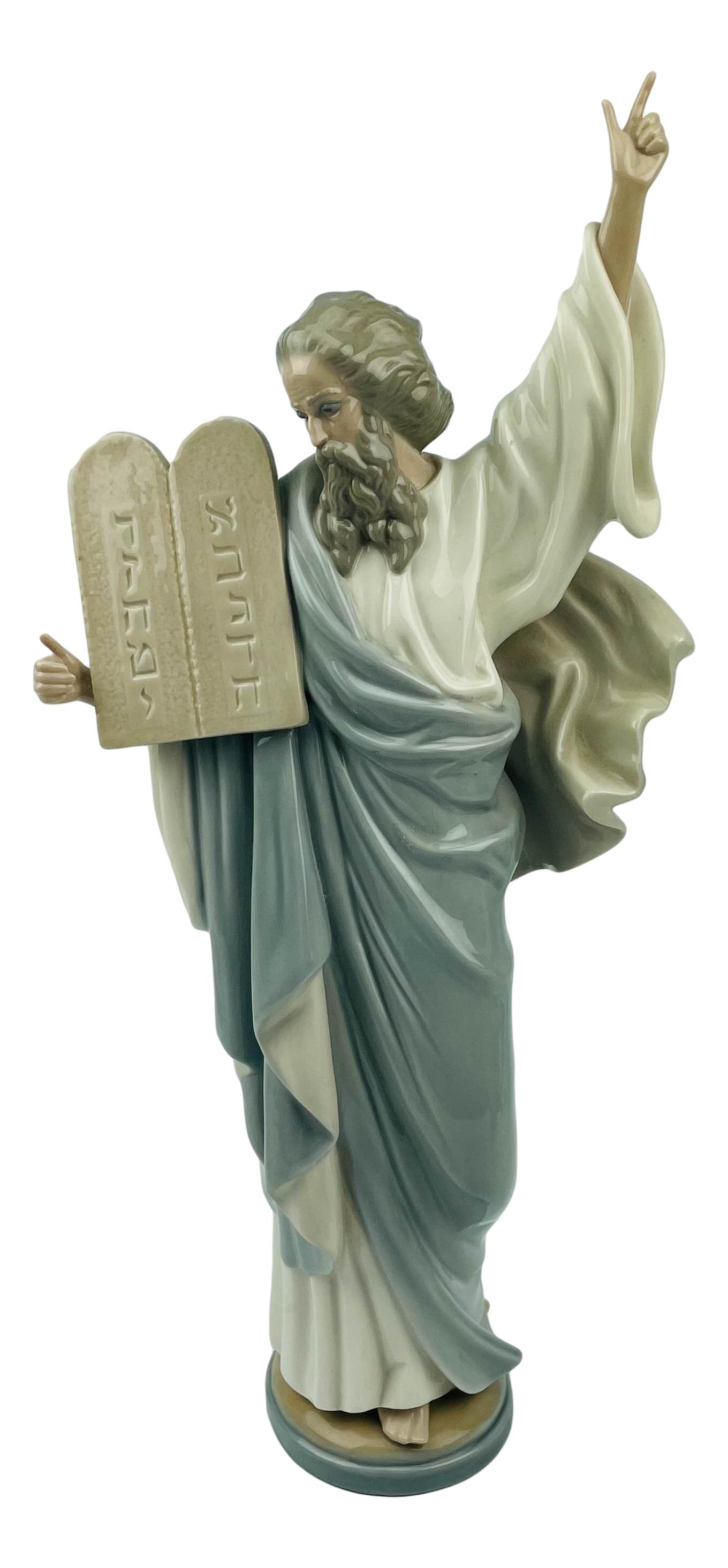 Lladro Moses # 5170 Religious Porcelain Figurine: Designed by sculptor Francisco Catala. Production Years : 1982 - 2000. Finish : Glazed. Signed ~ stamped with the blue tulip flower Lladro Handmade in Spain Daisa 1982. Dimensions: 16.25 X 7.25 X 3 in