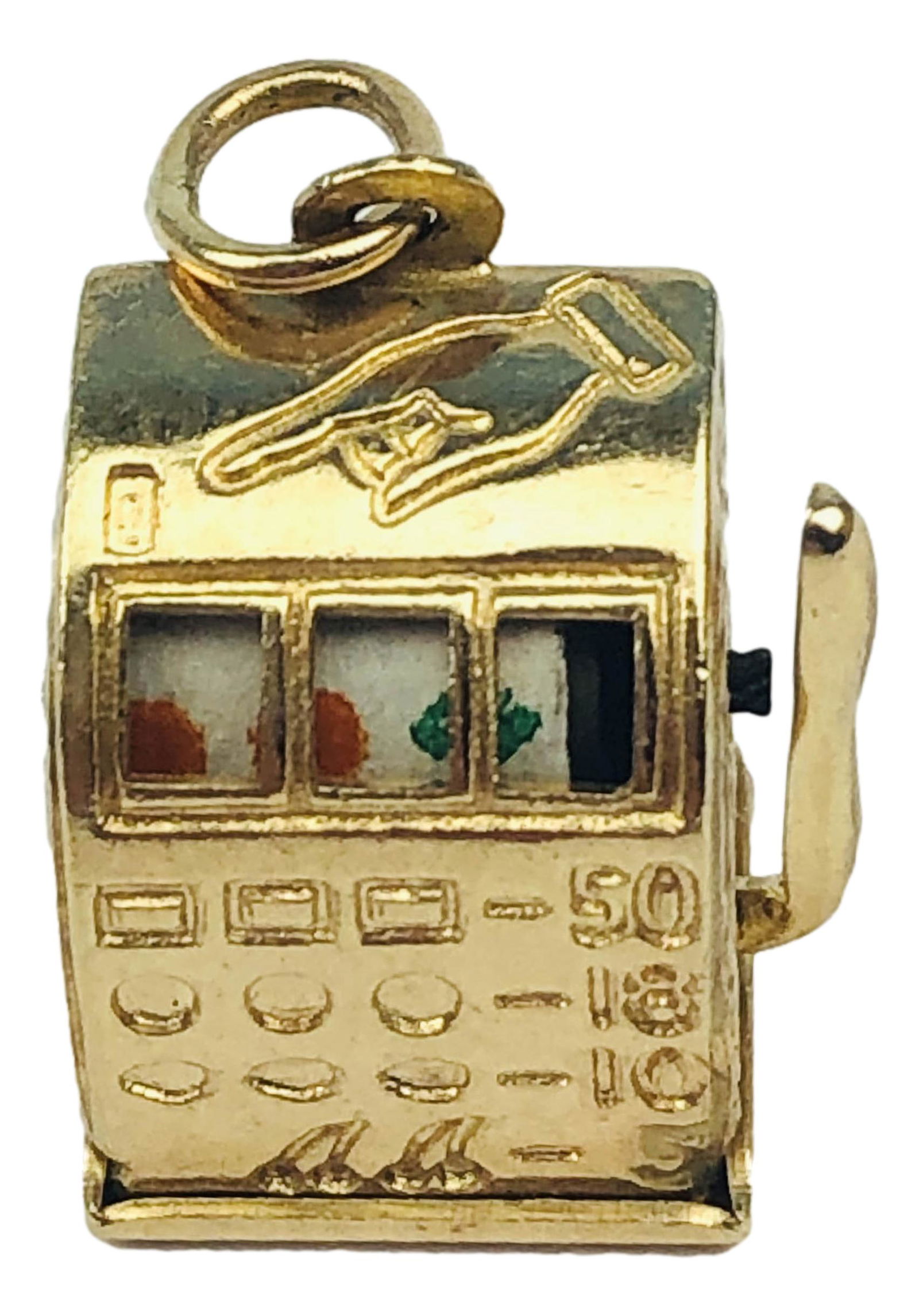 14K Las Vegas Slot Machine Charm Necklace Pendant: Solid 14K yellow gold casino gaming slot machine with articulated arm bracelet charm necklace pendant. Measures 3/4" x 1/2". Signed ~ stamped 14K. Total weight 6,4 grams.Condition: Good overall condit