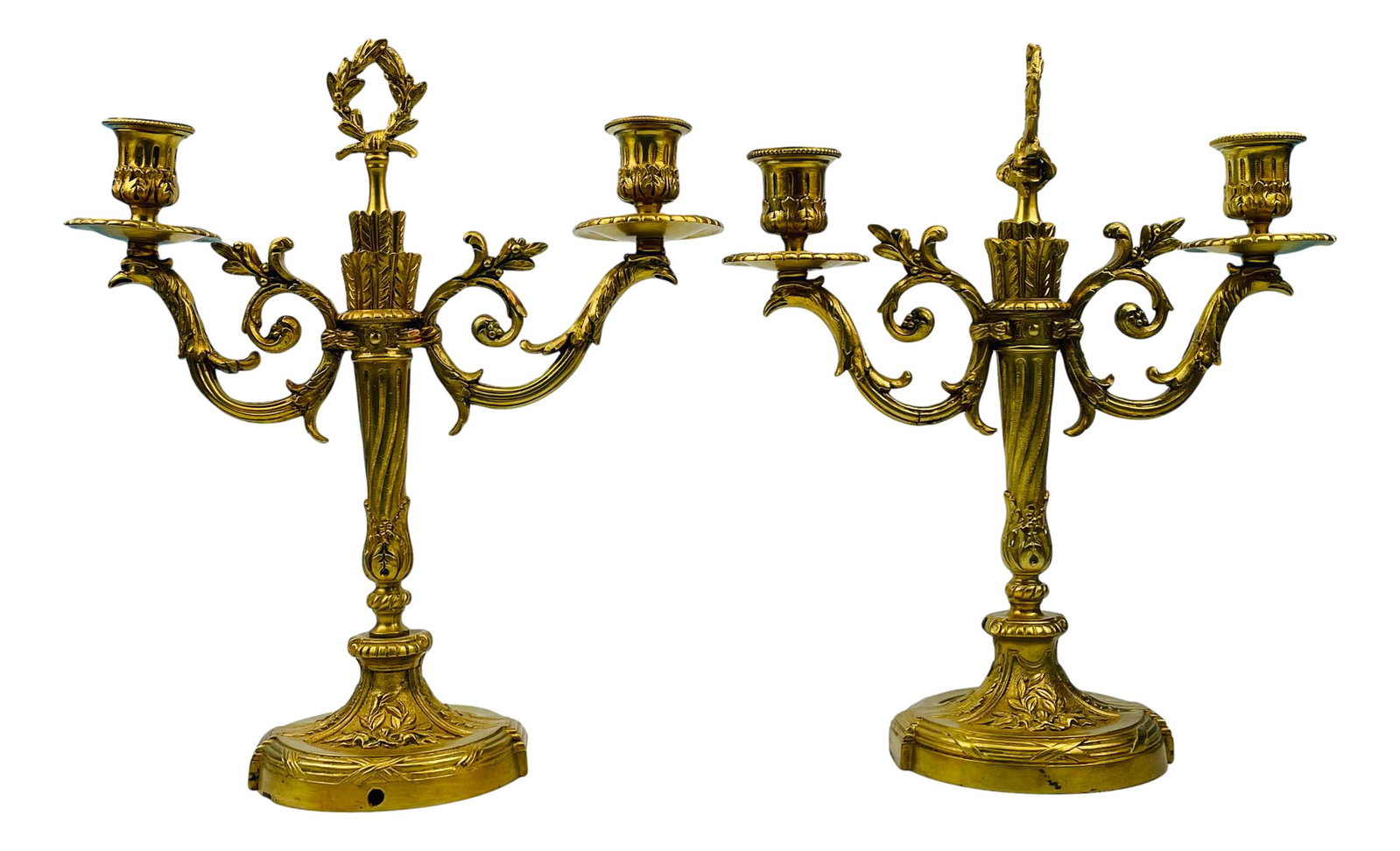 Antique French Dore Bronze Baroque Candleholders: Late 19th early 20th century French dore bronze Baroque style candle holders. Both graced with 2 arms, each for a single candle with each featuring ornate and lavish raised decorations. Candle opening