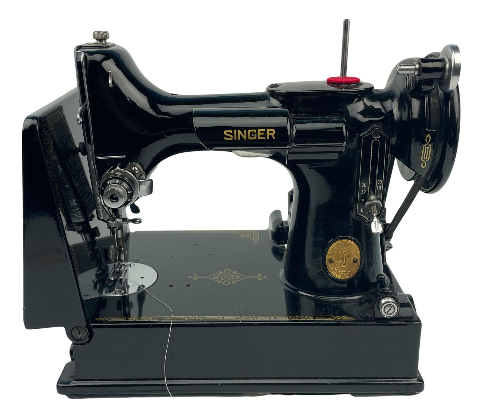 Singer Featherweight 221 Sewing Machine in Case: Singer Featherweight 221 sewing machine in case. Has fold down arm. Edging accessory along with thread included in case. The case also contains manuals of other Singer sewing machines. Serial number E