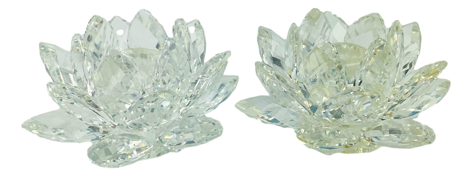 Swarovski Crystal Waterlily 2 Glass Candleholders: Designed by Max Schreck. Production years 1985 - 2020. Each modeled in the shape of a multi petal waterlily and mounted atop 3 crystal ball feet. Candle opening size 1/2" in diameter. Signed ~ stamped