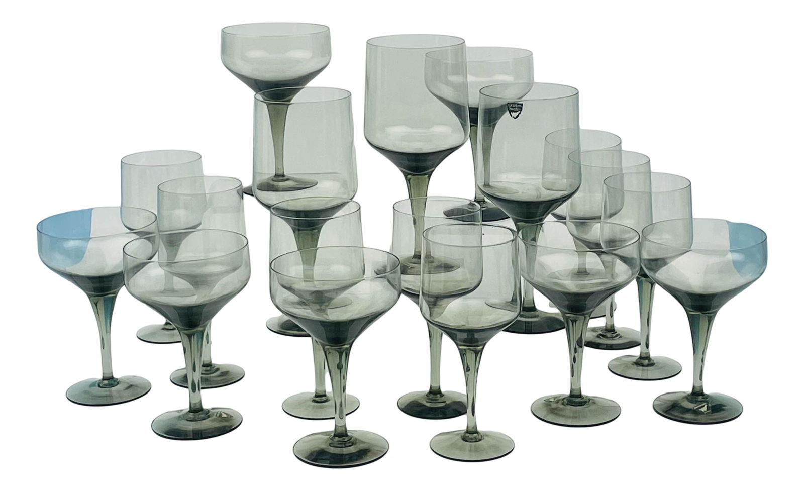 Orrefors Sweden Rhapsody Smoke Stemware 24pc LOT: Pattern : Rhapsody Smoke. Production Years : 1967 - 1991. Designed by Sven Palmqvist ( Swedish, 1906 - 1984 ). Includes ~ 8 x Claret Wine Goblets. 9 x Water Goblets. 7 x Champagne Sherbets. Measure fr
