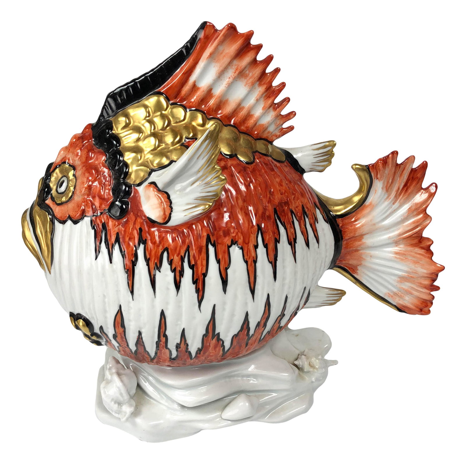Sergio Dante Capodimonte Porcelain Fish Figurine: 20th century studio handcrafted European origin nature figurine. Depicts a whimsical venomous tropical fish with hand painted orange, gold and black markings against a white ground. surmounted atop a 