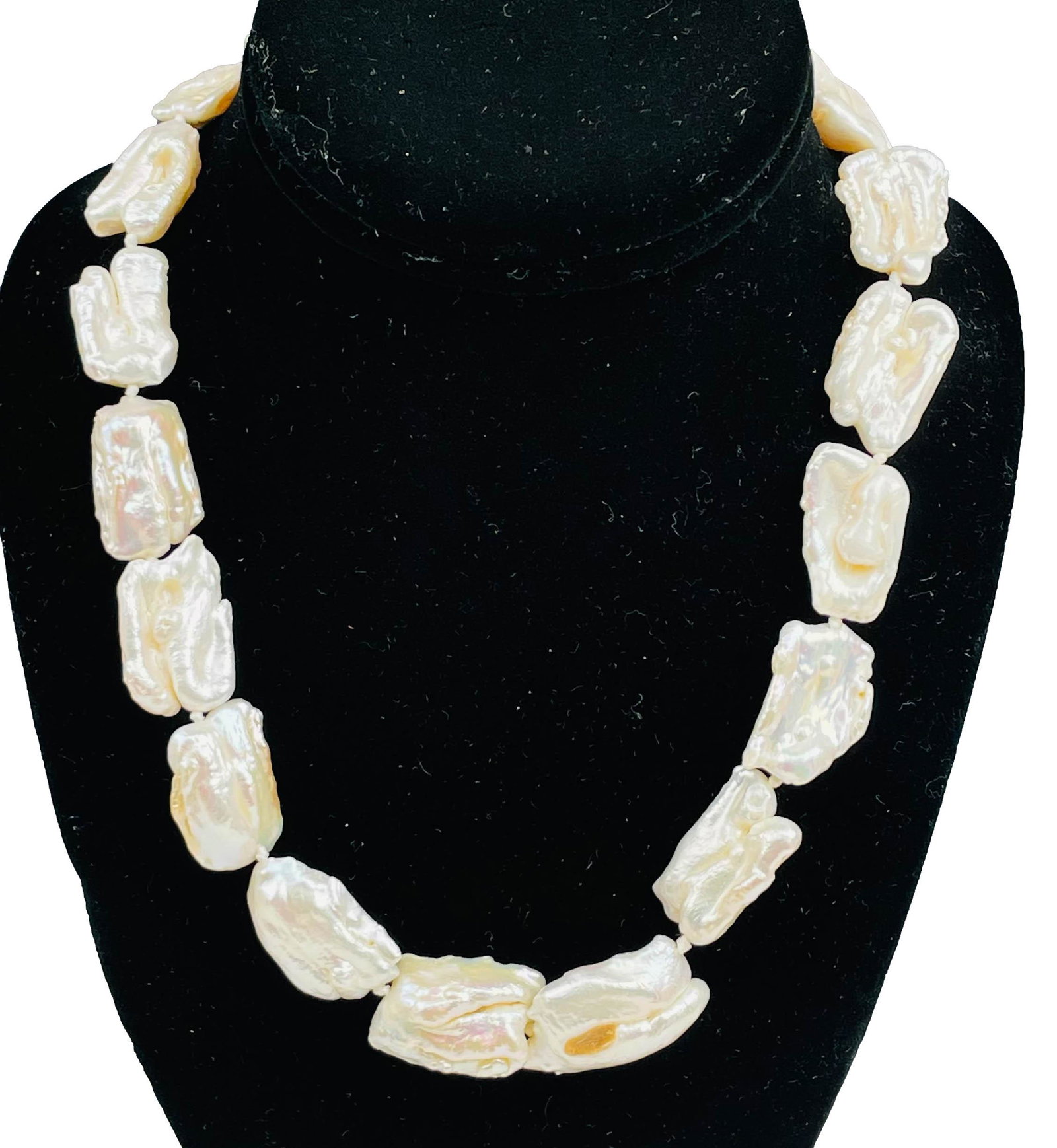 Huge Baroque 18" Freshwater Blister Pearl Necklace: Handcrafted article of women's jewelry featuring hand knotted single strung white Baroque blister pearls, a total of 18 count. Finished with silver tone filigree clasp. Warm luster and sheen seen to e