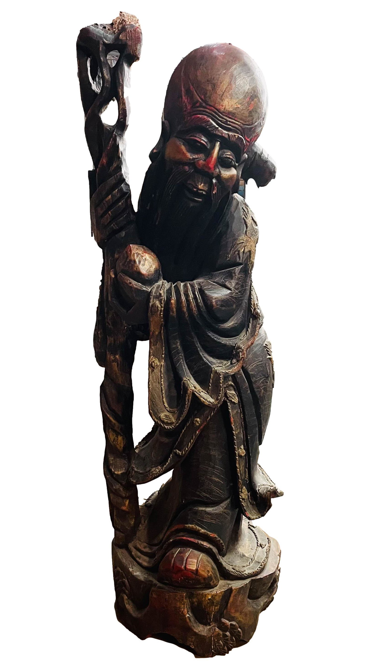 Chinese 39" Wooden Shou & Immortal Peach Sculpture: Old Chinese carved wood sculpture of Shou, one of the three Sanxing representing Longevity. Featured bearded and holding a peach and staff. Quality craftsmanship, with worn gilt and red lacquered fini