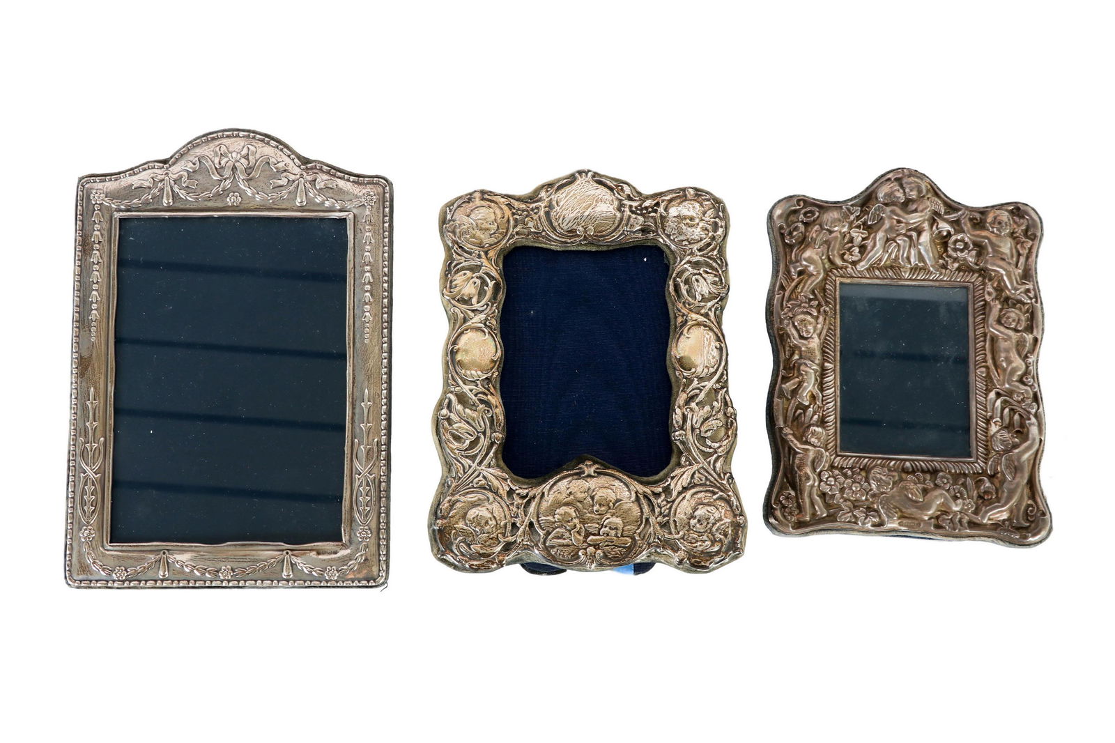 English Sterling Silver Repousse Picture Frame LOT: Estate collection of sterling silver photo frames. Lot includes: (2) Richard Carr Sheffield England and 1 x London sterling silver photo photograph picture frames. 2 feature raised relief repousse nud