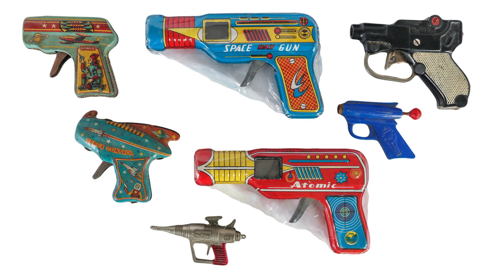 Space Ray Atomic G-Man Rodondo Metal Toy Gun LOT: Estate collection of vintage metal toy guns. Lot includes a total of 7 metal, tin litho and plastic toy guns. The names include Atomic ( large red tinplate gun ), Space Ray Gun ( large blue tinplate g