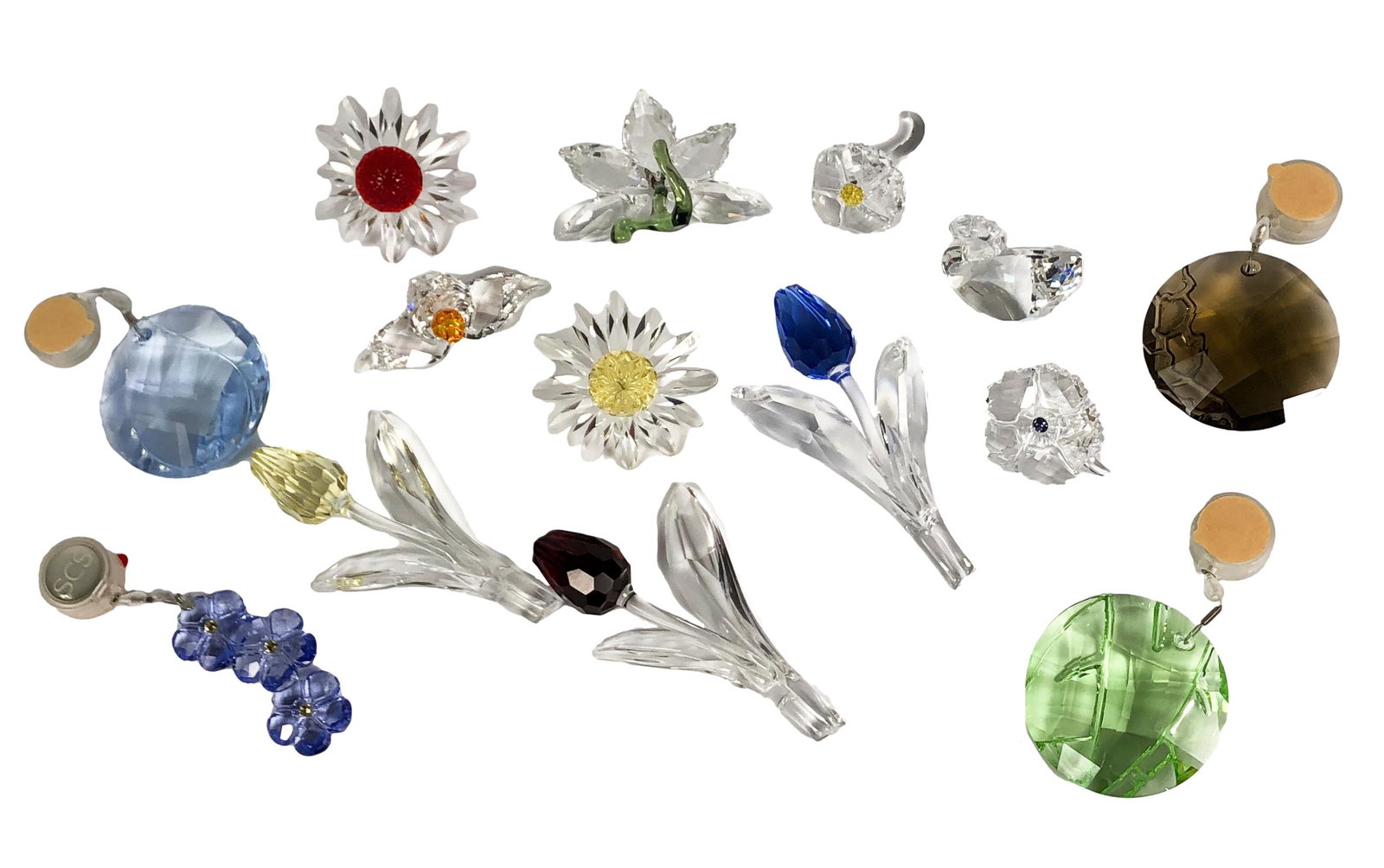 Swarovski Austrian Crystal Glass Figurine 14pc LOT: Estate collection of Swarovski Austrian crystal. Includes ~ 4 x Suncatchers. 3 x Tulips. 2 x Daisies. 2 x Orchids. 2 x Flowers with Stems. 1 x Mini Swan. Measure from 1" - 3 3/4" in height x 1 1/8" - 
