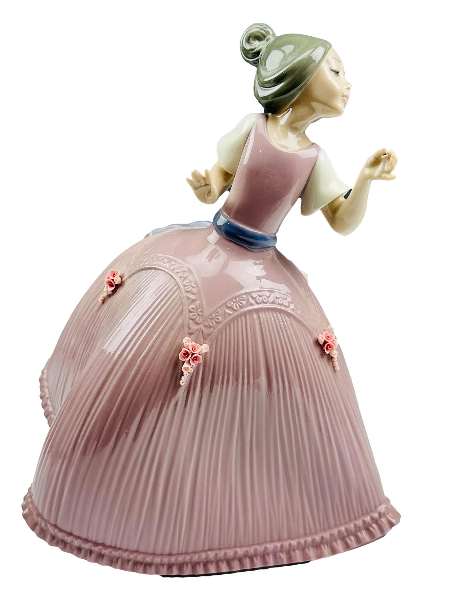 Lladro Girl in Pink Dress #5120 Porcelain Figurine: Titled : Girl in Pink Dress. Model number 5120. Designed by sculptor Jose Puche. Production years : 1982 - 1985. Finish : Glazed. Signed ~ stamped with the blue tulip flower backstamp Lladro Handmade 