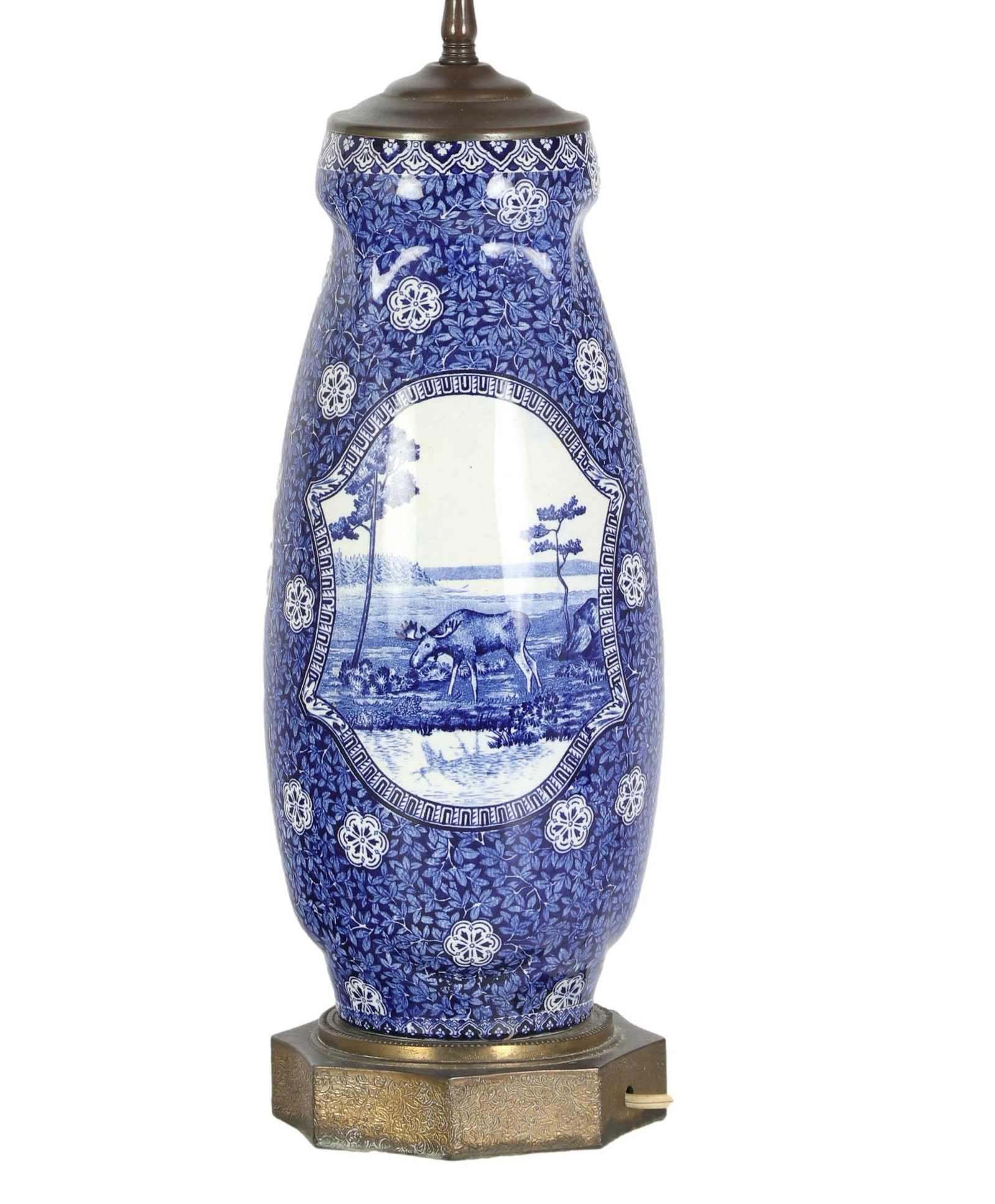 Staffordshire Blue Transferware Moose River Lamp: Features a moose foraging in a wooded type area in a cartouche on one side, the opposite side with a river, tree and mountain landscape, the remainder of the lamp body encased with an abundance of a f