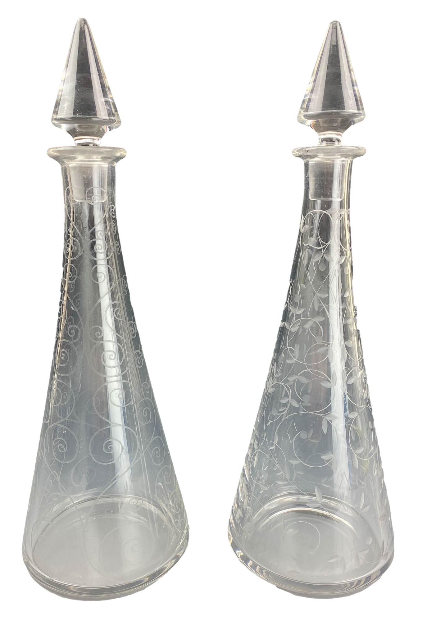St Louis Crystal Etched Scroll Liquor Decanter SET: 2 x 20th century St Louis crystal art glass bar barware alcohol liquor wine bottle stoppered decanters. The conical shaped body showcases an etched scroll pattern, on one, an etched leaf design on the