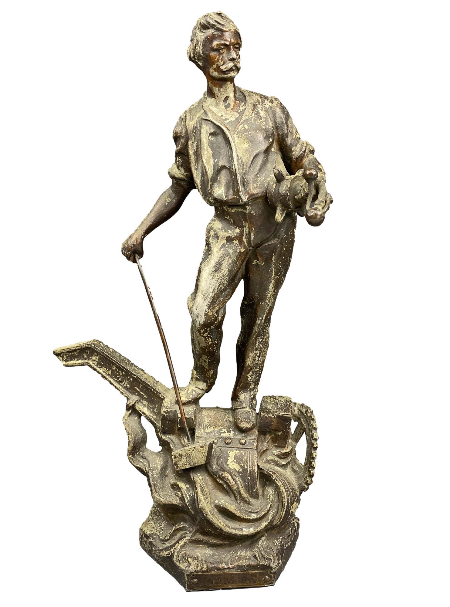 Spelter Industrial Age Factory Worker Figurine 13": Antique early 20th century spelter / white metal figural sculpture. Depicts this Social Realism figure in standing pose holding machinery and mounted atop some form of machine. No apparent markings. D