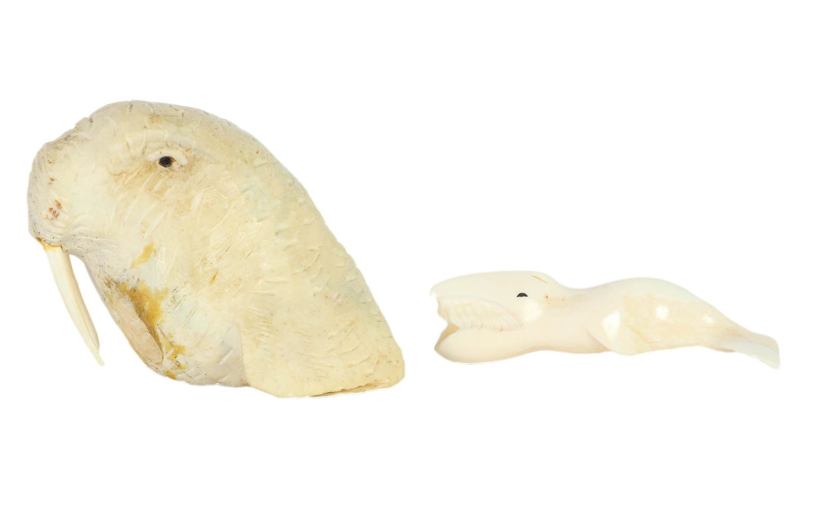 Inuit Eskimo Alaska Native Indian Carved Artifacts: Includes ~ 1 x bust of a walrus with hand carved details from natural carved material. 1 x smooth high polished small whale fish sculpture. Measure from 1 1/8" - 3" in height x 4" in length. Signed H.