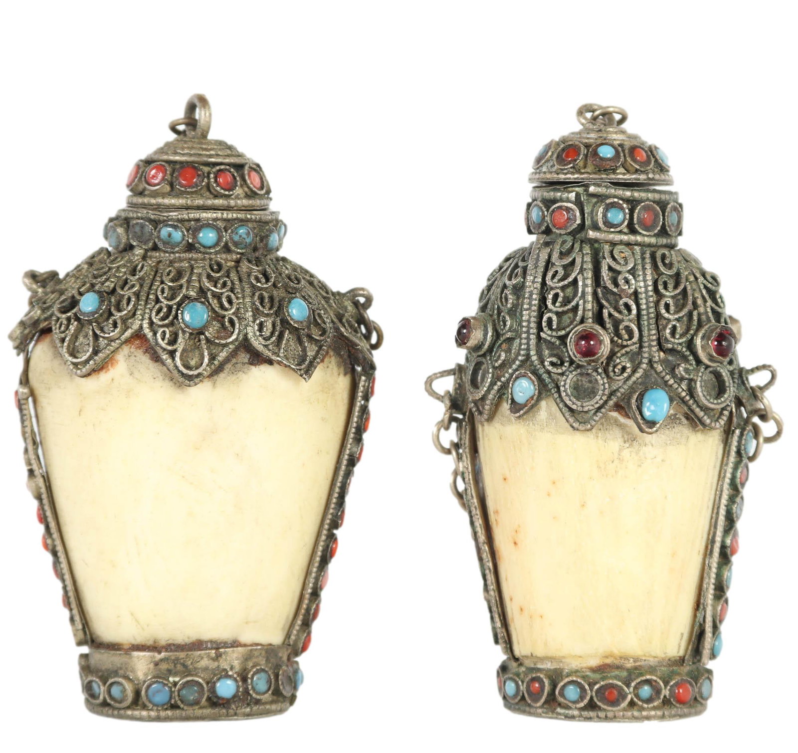 Nepalese Pair of Bovine Carved Snuff Bottle MARKED: A lot of two (2) Nepalese snuff bottles carved from bovine bone. Attached spoons surmount a stone and glass bead decorated filigree that covers the bottles. Both stamped with a lotus symbol to bottom.