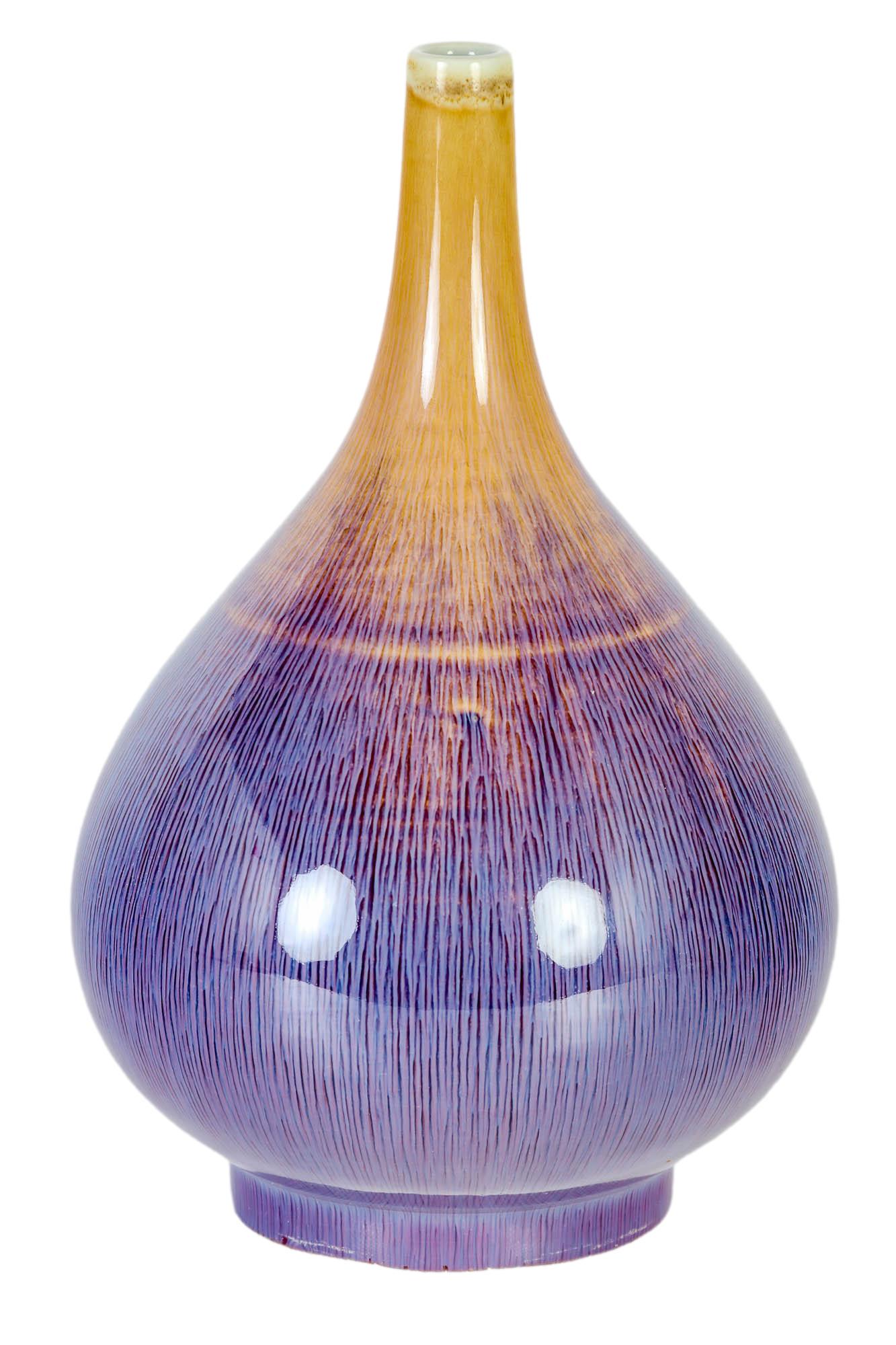 Chinese Porcelain Flambe Glaze Lavender Brown Vase: Of warm nature inspired onion / garlic bulb shape with a white coloration at the mouth beige coloration to the neck and collar, a purple blue pink vertical line design around the remainder of the body