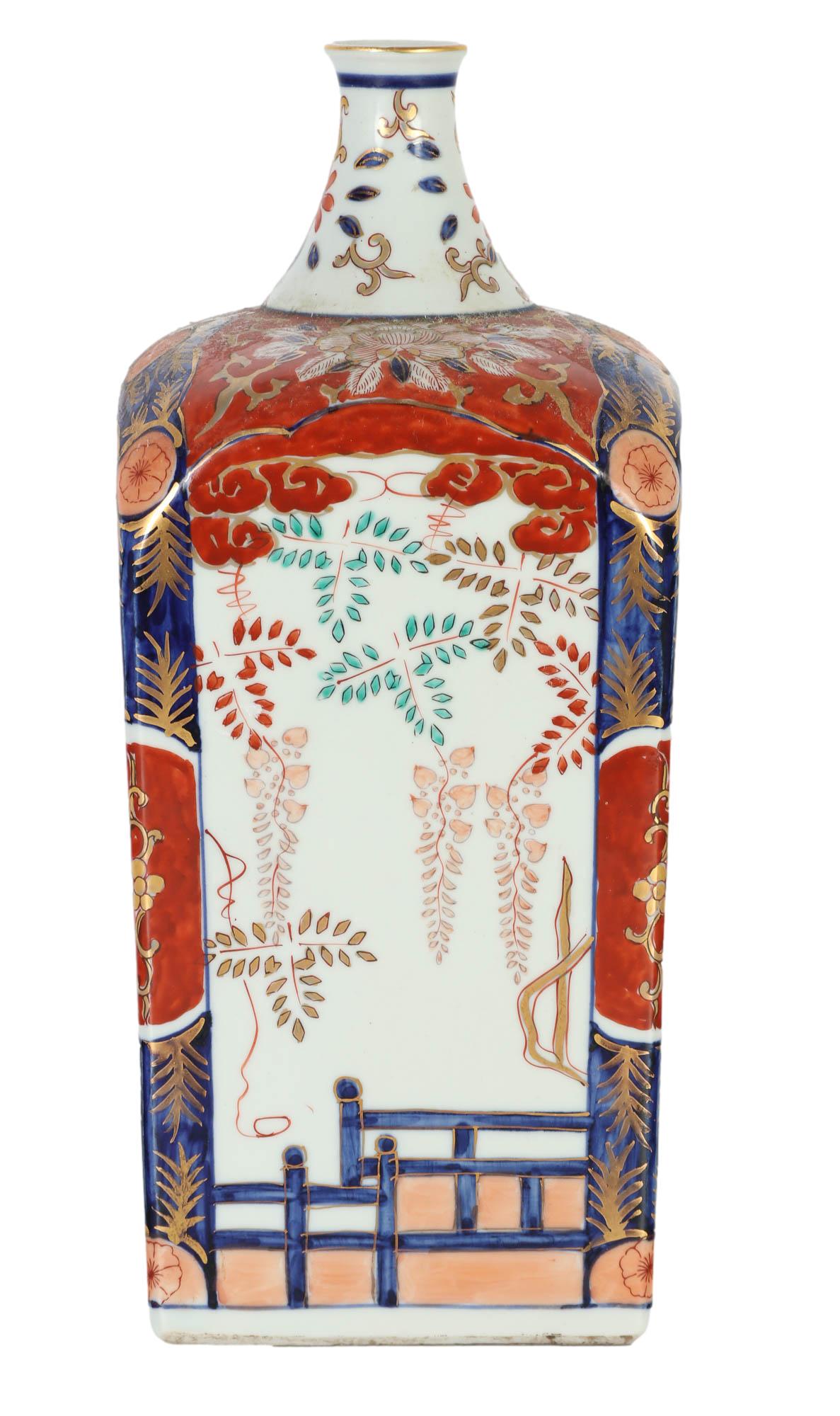 Japanese Kutani Floral Rust Blue Porcelain Vase: 20th century hand painted porcelain article of Japanese cultural art. The rectangular shaped body graced with sloped edge corners with short neck having open mouth. Floral rust, blue and green design 