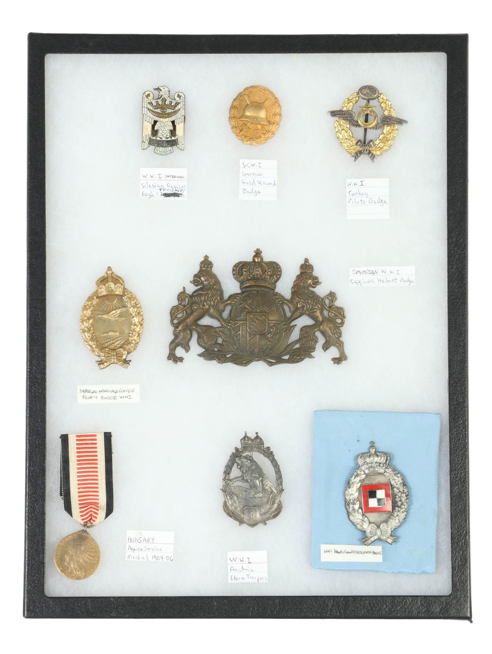 WWI Era Central Powers Military Medals and Badges: An estate collection with eight (8) original First World War German military medals and badges. Includes: one (1) Silesian Eagle 1st Class badge awarded for service during the Silesian Uprisings of th