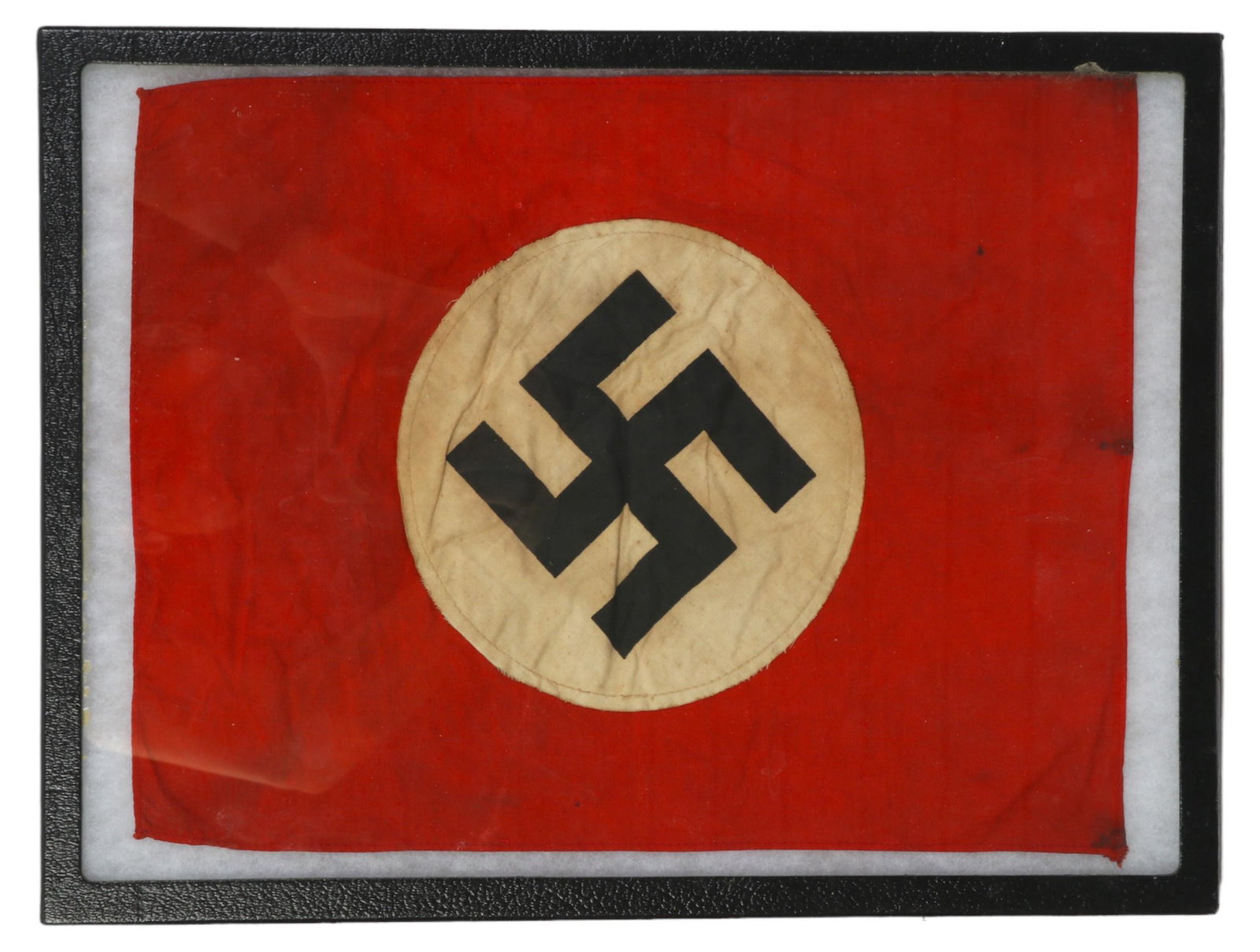 WWII Third Reich Staff Car Swastika Banner Flag: An original Second World War National Socialist German Workers Party NSDAP staff car hood mounted flag. Red fabric background with circular white fabric field and black fabric swastika to center. Pres