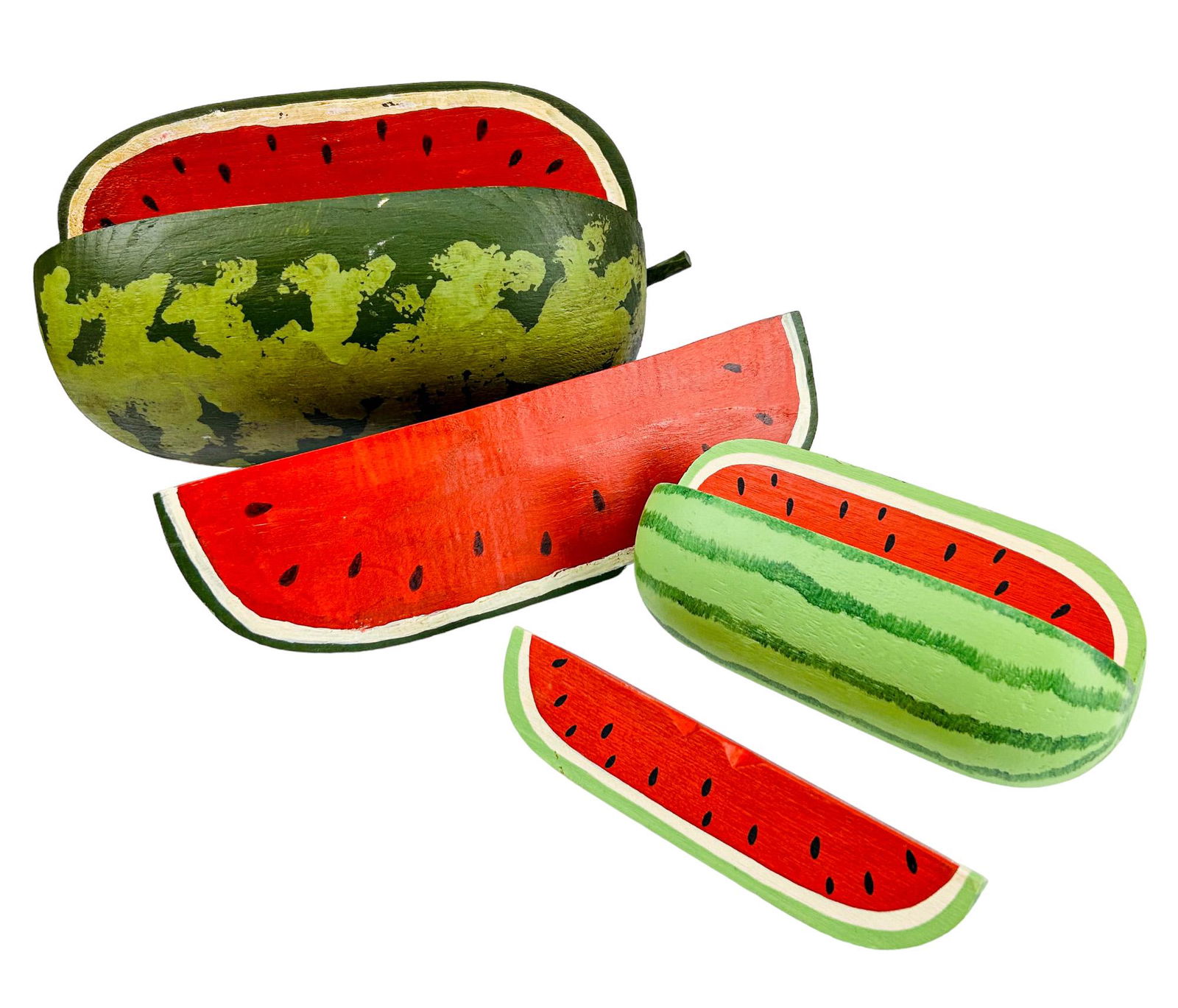 2 Folk Art Carved Wood Watermelon Fruit Sculptures: 20th century hand carved and hand painted sculptures. Each features luscious red ripened watermelon fruits. Measure from 3 3/4" - 6 1/2" x 7 3/4" - 10 1/2". No apparent markings. Condition: Good overa