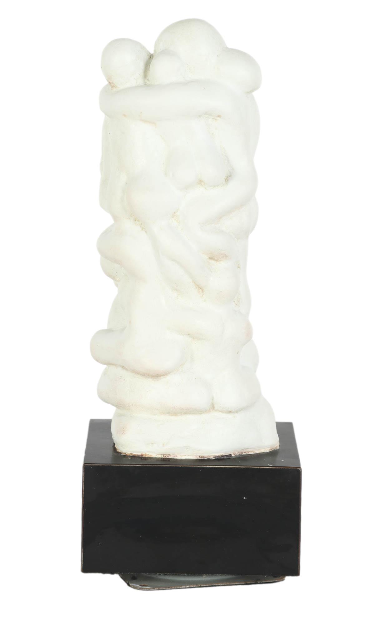 20C Cluster Of Embraced Nudes Abstract Sculpture: Mid Century Modernist composition sculpture featuring a group of nude figures in a totem pole formation. Mounted to a black square rotating base. No apparent artist signature. Work Size: 45 in. Dimens