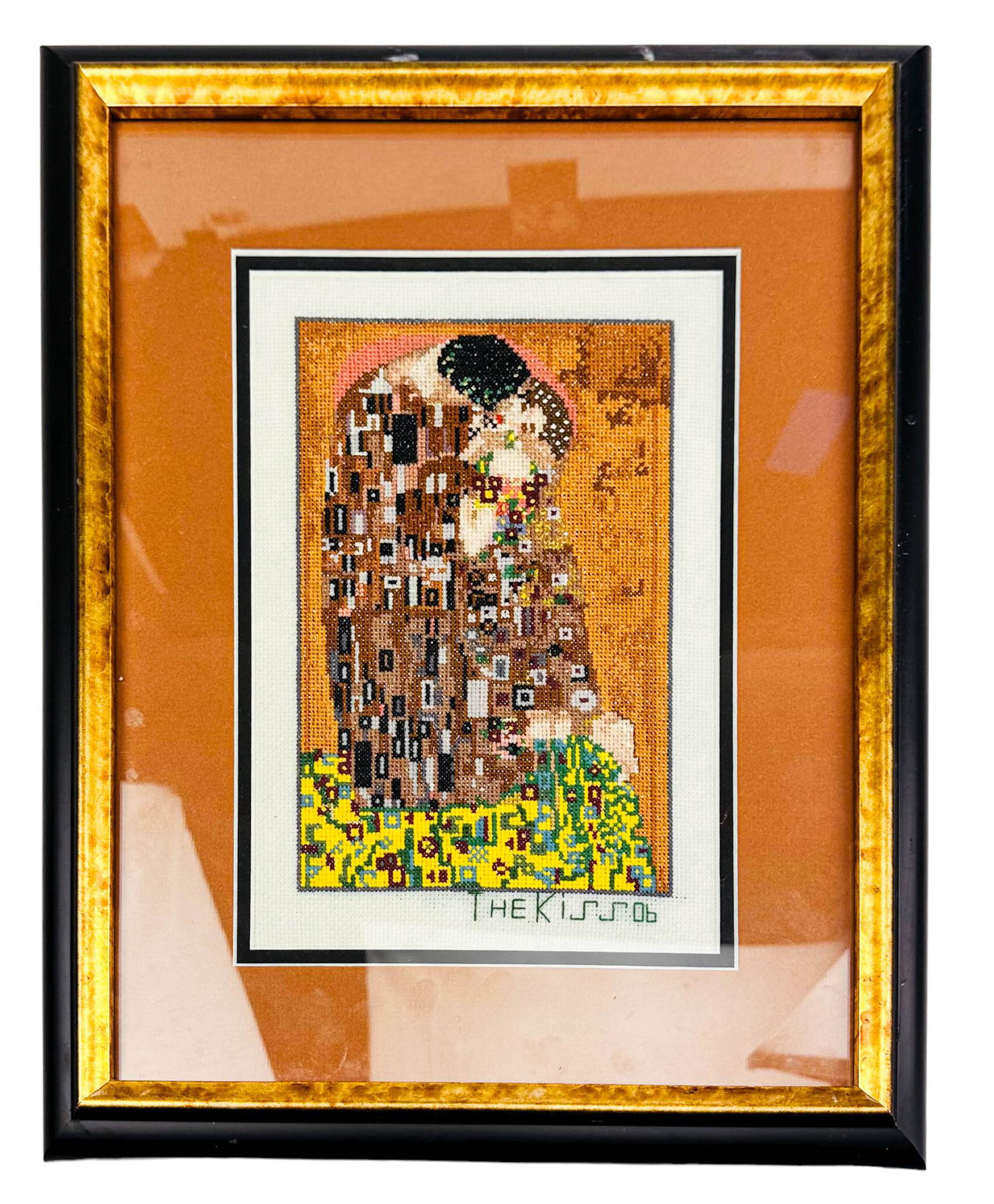 "The Kiss" Handmade Embroidered Framed Wall Art: This popular work titled "The Kiss" in embroidery medium depicts an embracing couple kneeling in a grassy patch of wildflowers. Executed after Gustav Klimt ~ The Austrian Symbolist painter. Signed ~ h