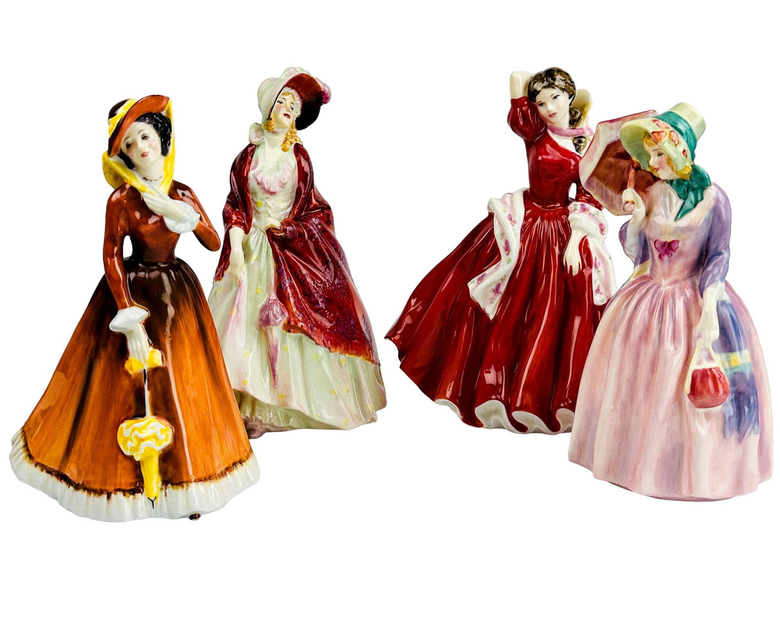 Royal Doulton Curio Display Lady Figurine 4pc LOT: Includes the following English bone china figurines. 1 x Paisley Shawl HN 1392. Designed by : Leslie Harradine. Production years : 1938 - 1949. 1 x Julia HN2705. Designed by :Margaret Peggy Davies. Pr
