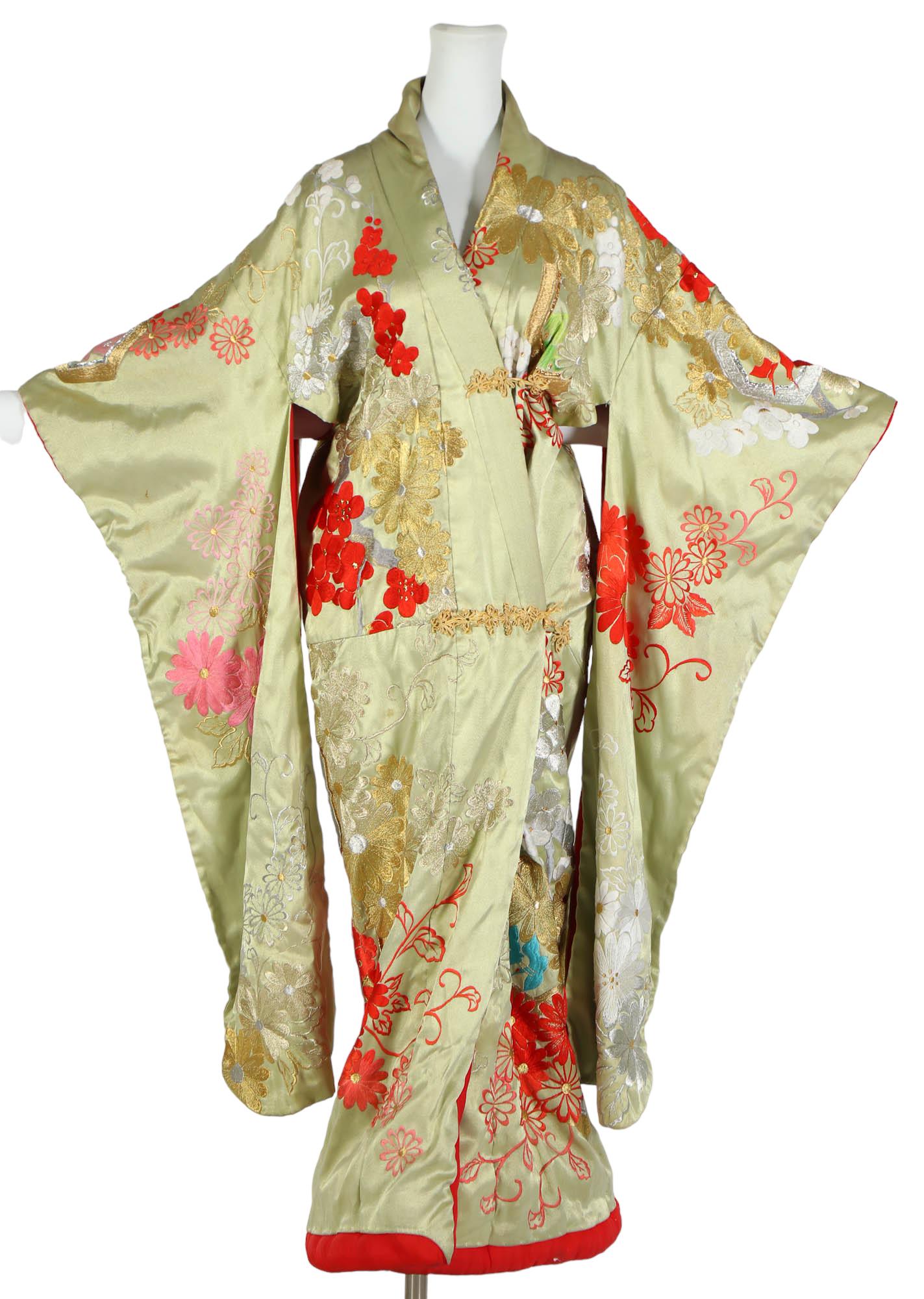 Japanese Silk Embroidered Gold Thread Floral Robe: Hand stitched and embroidered Japanese garment with a floral design. Measures approximately 57" in height. Bust ~ approximately 42". Sleeves ~ 12" approximately. Condition: Good overall condition havi