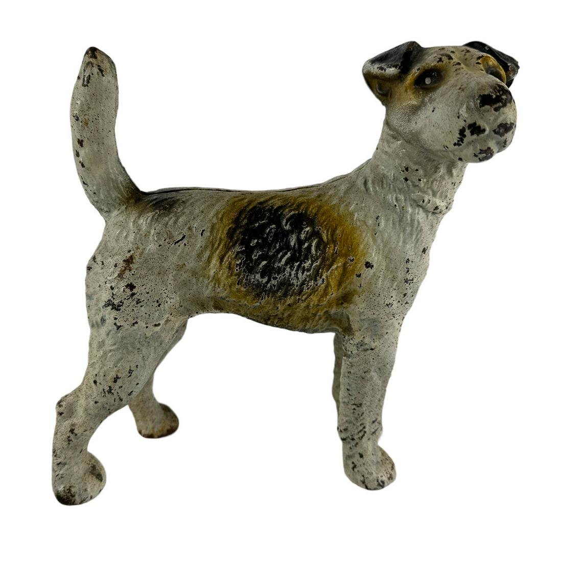 Hubley Cast Iron Wire Hair Fox Terrier Door Stop: 20th century cast iron animal metal K9 dog with polychrome enamel paint. Two piece construction. Features this charming and smart housemate with wiry rough coat and neatly folded V shaped ears. No app
