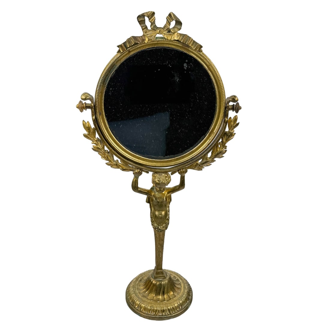 Antique French Bronze Nude Cherub Vanity Mirror: early 20th century France French gilt bronze bathroom dresser ladies make up shaving mirror. This tabletop swivel mirror graced with a ribbon bow atop with a mini beaded design around, a berry and lea