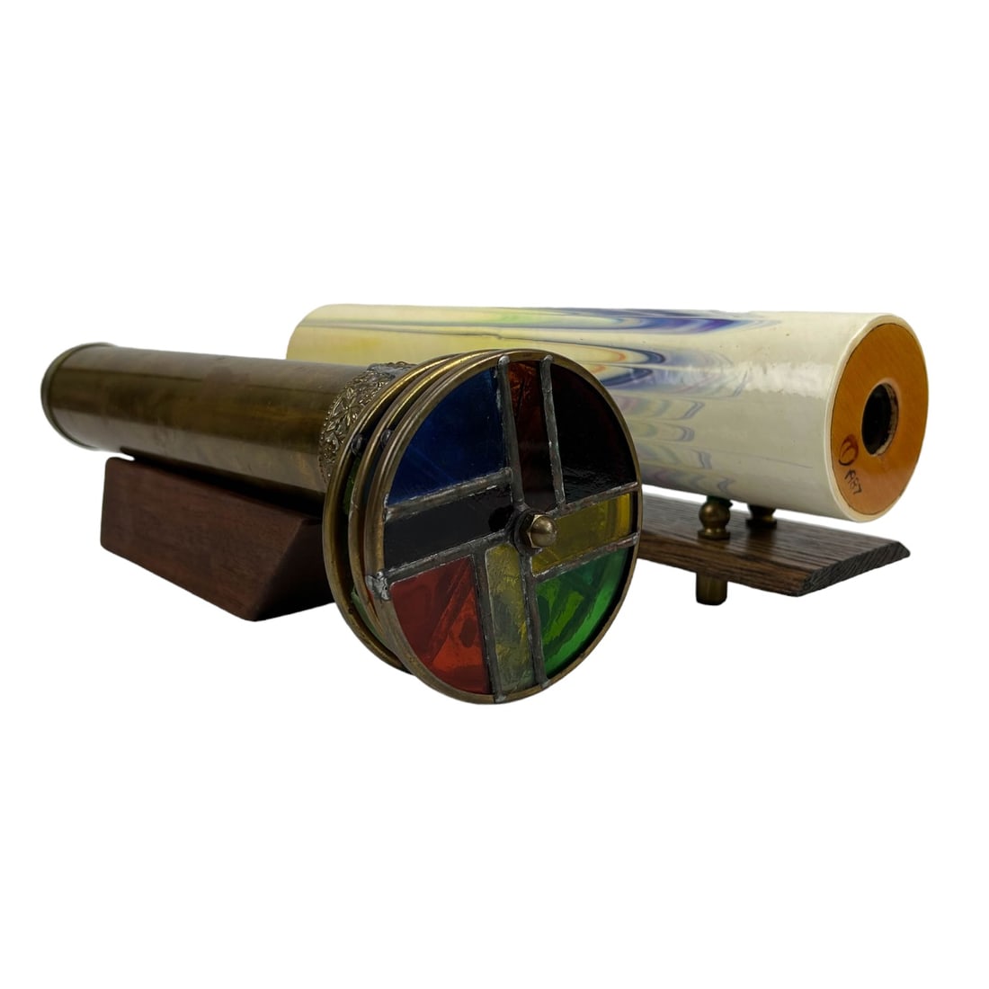 Peach Reynolds & Brass Artist Made Kaleidoscopes: Includes ~ 1 x Peach Reynolds hand made marbled paper exterior with colorful interiors. 1 x brass framed construction with 3 movable wheels. Both accompanied with wood stands. Measure from 12 3/4" - 3