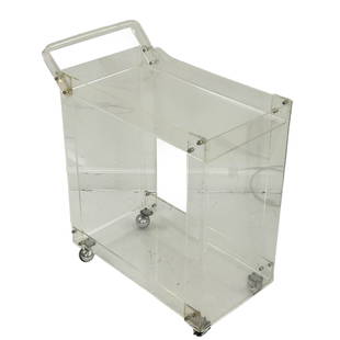 Mid Century Modern MCM Lucite Acrylic Tea Cart: Two tier clear lucite tea cart with sturdy handle. Mounted atop 4 moveable wheels. No apparent markings. Dimensions: 31 X 25 X 13.25 in. Condition: Good overall condition having normal surface we