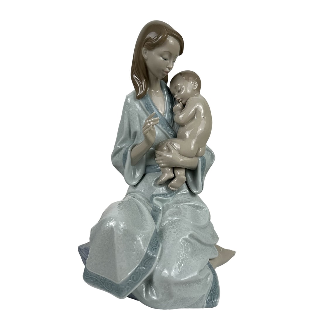 Lladro Sleep My Love #8030 Mother Child Figurine: Titled : Sleep My Love. Model number : 8030. Sculptor : Joan Coderch. Production years : 2004 - 2008. Finish : Glazed. Subject matter captures the tenderness and love of a young mother holding her inf