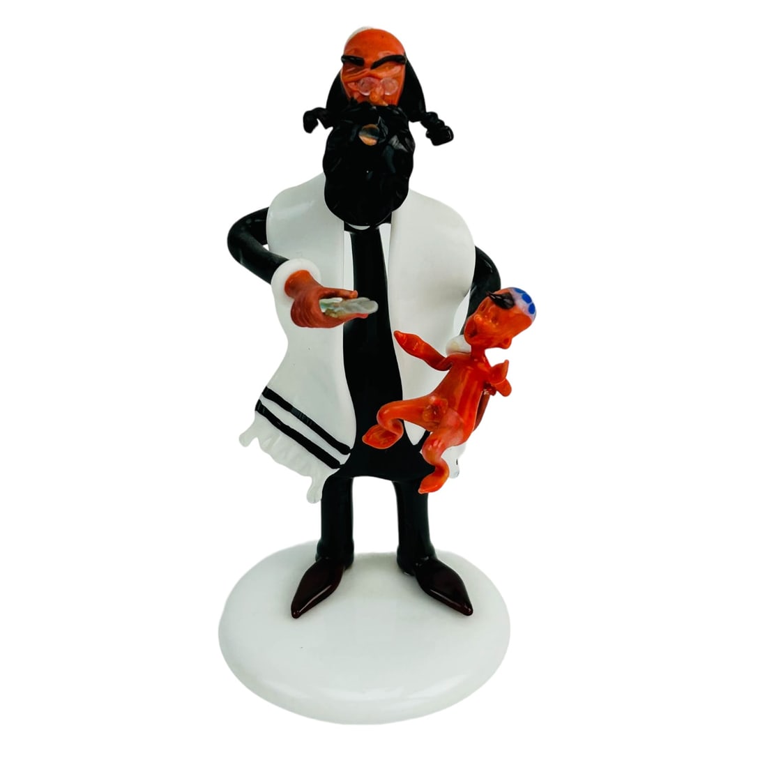 Moretti Raffael Rabbi Baby Bris Murano Sculpture: A postwar 20C Italian Murano art glass lamp work figurine. This Jewish Judaica themed figural work depicts a Rabbi performing a bris / mohel to a young child. Affixed to a white round glass base. Impr